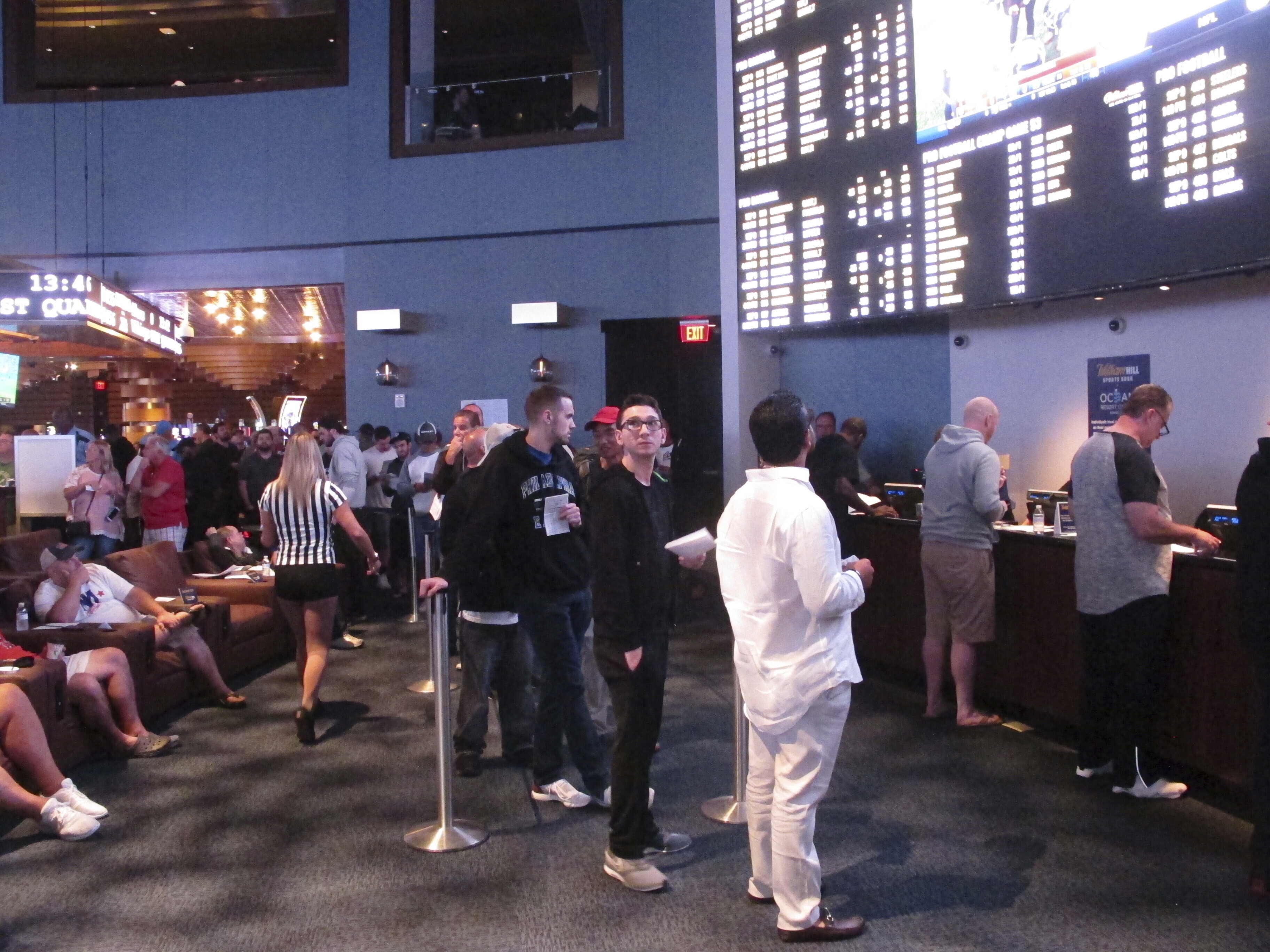 Gamblers line up to make sports bets at the Ocean Casino Resort in Atlantic City, N.J., on Sept. 9, 2018. NFL officials on Tuesday, Jan. 30, 2024, said viewers will only see three sports betting ads during the broadcast of the Super Bowl on Feb. 11. 