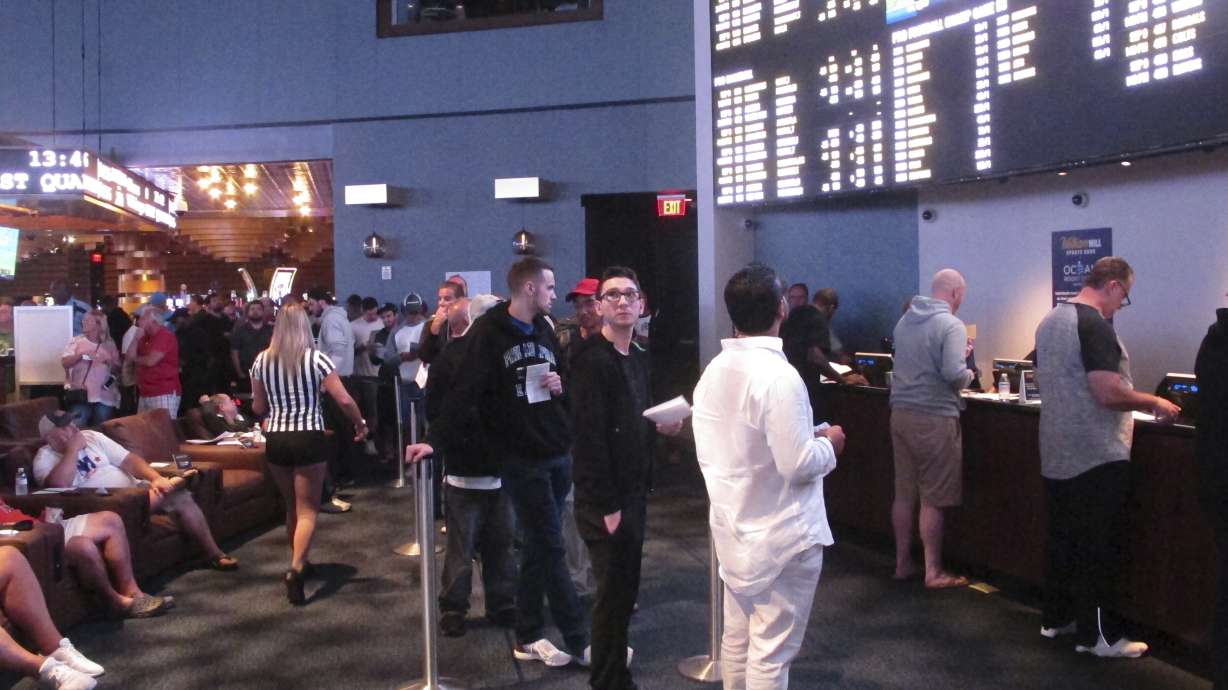Gamblers line up to make sports bets at the Ocean Casino Resort in Atlantic City, N.J., on Sept. 9, 2018. NFL officials on Tuesday, Jan. 30, 2024, said viewers will only see three sports betting ads during the broadcast of the Super Bowl on Feb. 11.