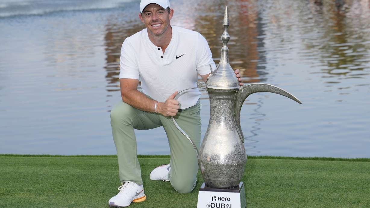 Rory McIlroy of Northern Ireland poses with his trophy after he won the final round of the Hero Dubai Desert Classic golf tournament, in Dubai, United Arab Emirates, Sunday, Jan. 21, 2024.