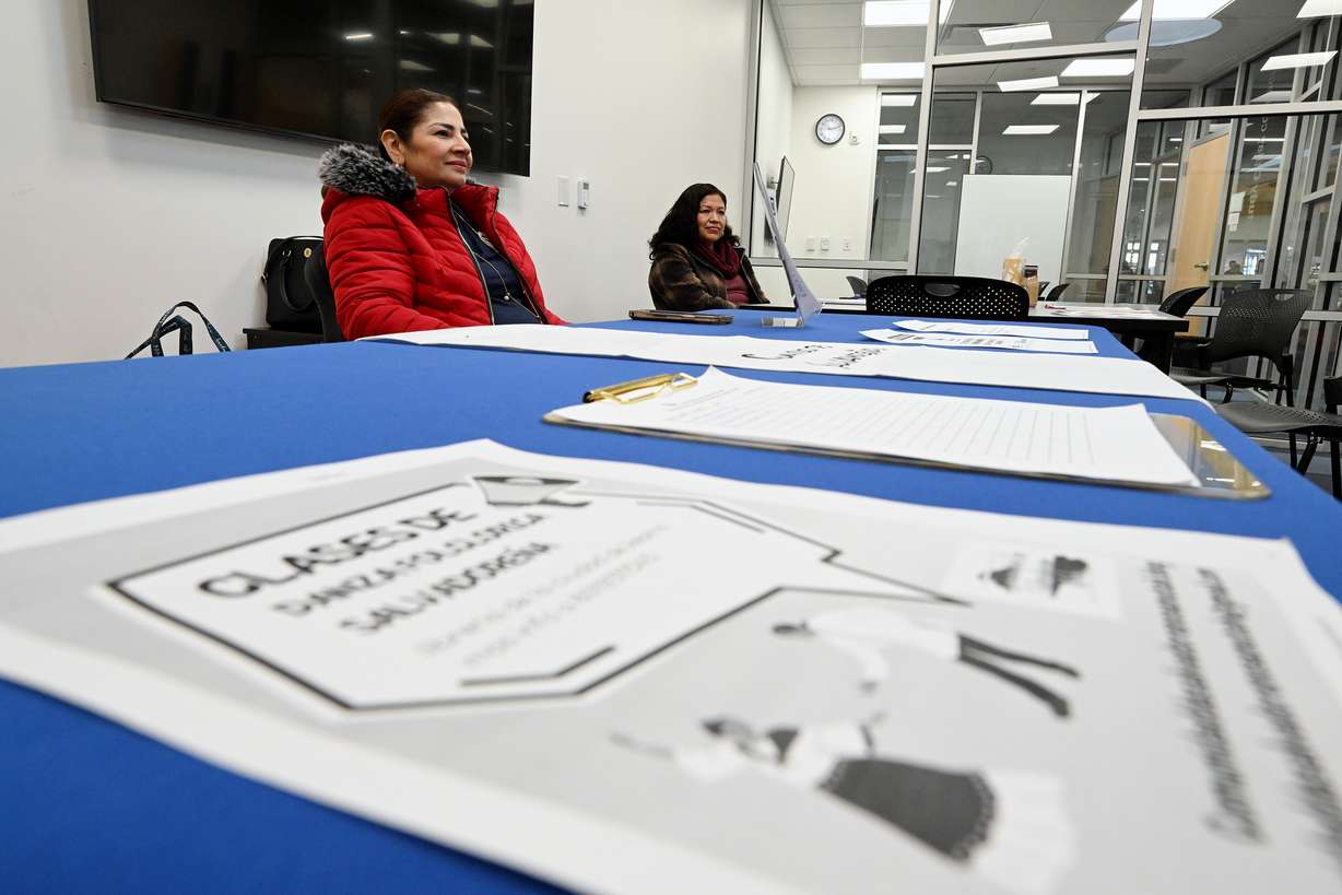 Gladis Rodriguez and Sofia Zelaya answer questions while at the Kearns Library waiting to assist anyone who might need help understanding the voting process for elections in El Salvador, on Friday. El Salvador expatriates have started presidential online balloting ahead of Election Day in the country, Feb. 4. Among the voters are many in Utah excited over the prospect of being able to have a say in the country's future.