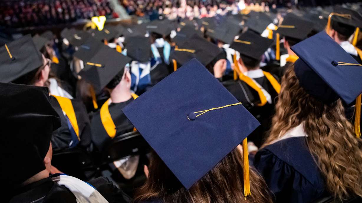A group of university graduates are pictured at commencement on April 27, 2023. Utah Rep. Burgess Owens introduced a bill Tuesday afternoon amending the application and review process for institutions of higher education that want to change ownership.