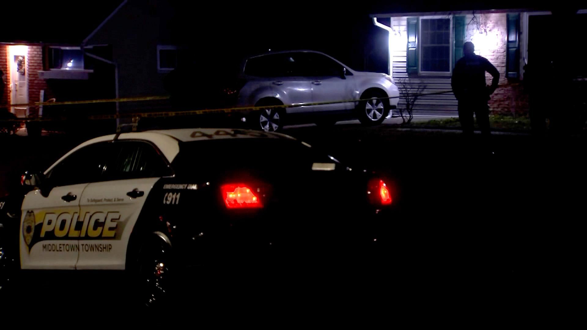 Members of law enforcement work the scene where a man in his 60s was found beheaded in Middletown Township, Pa., on Tuesday.