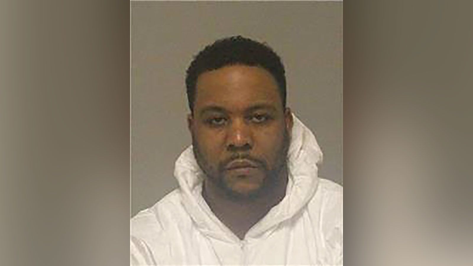 A Minnesota man, appearing to wear a UPS uniform, is accused of killing three people inside their Anoka County home on Jan. 26.