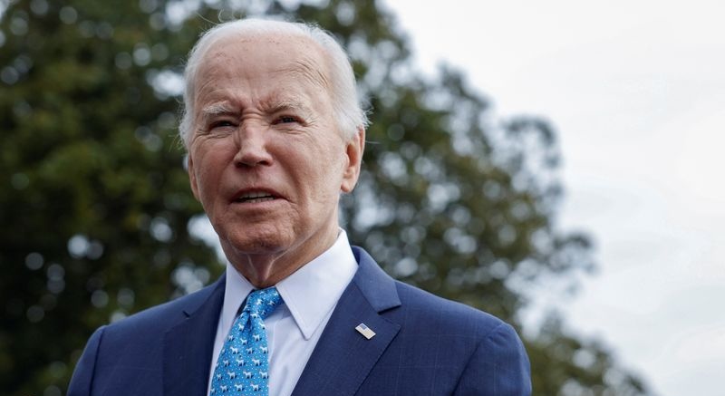 President Joe Biden looks on as he speaks to the media, before departing the White House for Florida on Tuesday. 
