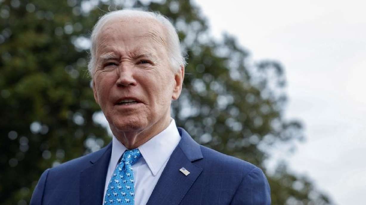 President Joe Biden looks on as he speaks to the media, before departing the White House for Florida on Tuesday.