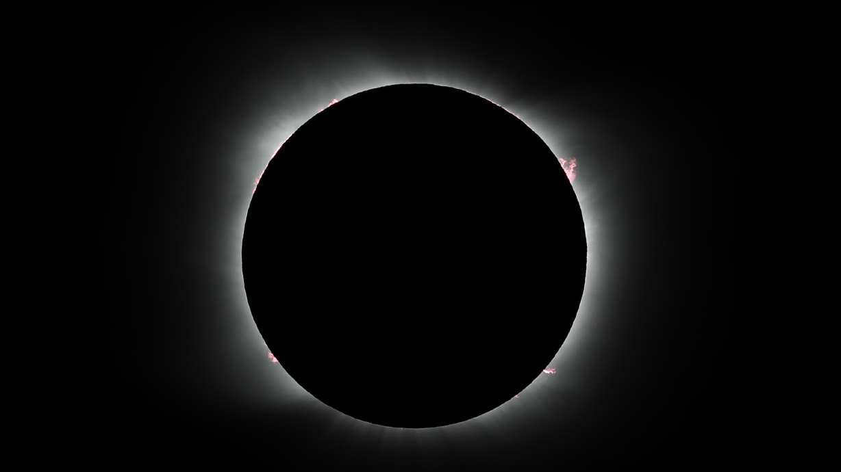FILE - The moon covers the sun during a solar eclipse in Piedra del Aguila, Argentina, Monday, Dec. 14, 2020. Officials are estimating 200,000 visitors will descend upon Cleveland April 8, 2024, to view a total solar eclipse — a once-in-generations event. The Cleveland Guardians baseball team has their home opener the same day. The Guardians have started their home openers in recent years with a 4:10 p.m. first pitch. This year, though, that falls in the partial-eclipse window. The team is weighing whether to embrace the eclipse and open the ballpark earlier to allow fans to watch the eclipse together — an opening act on opening day.