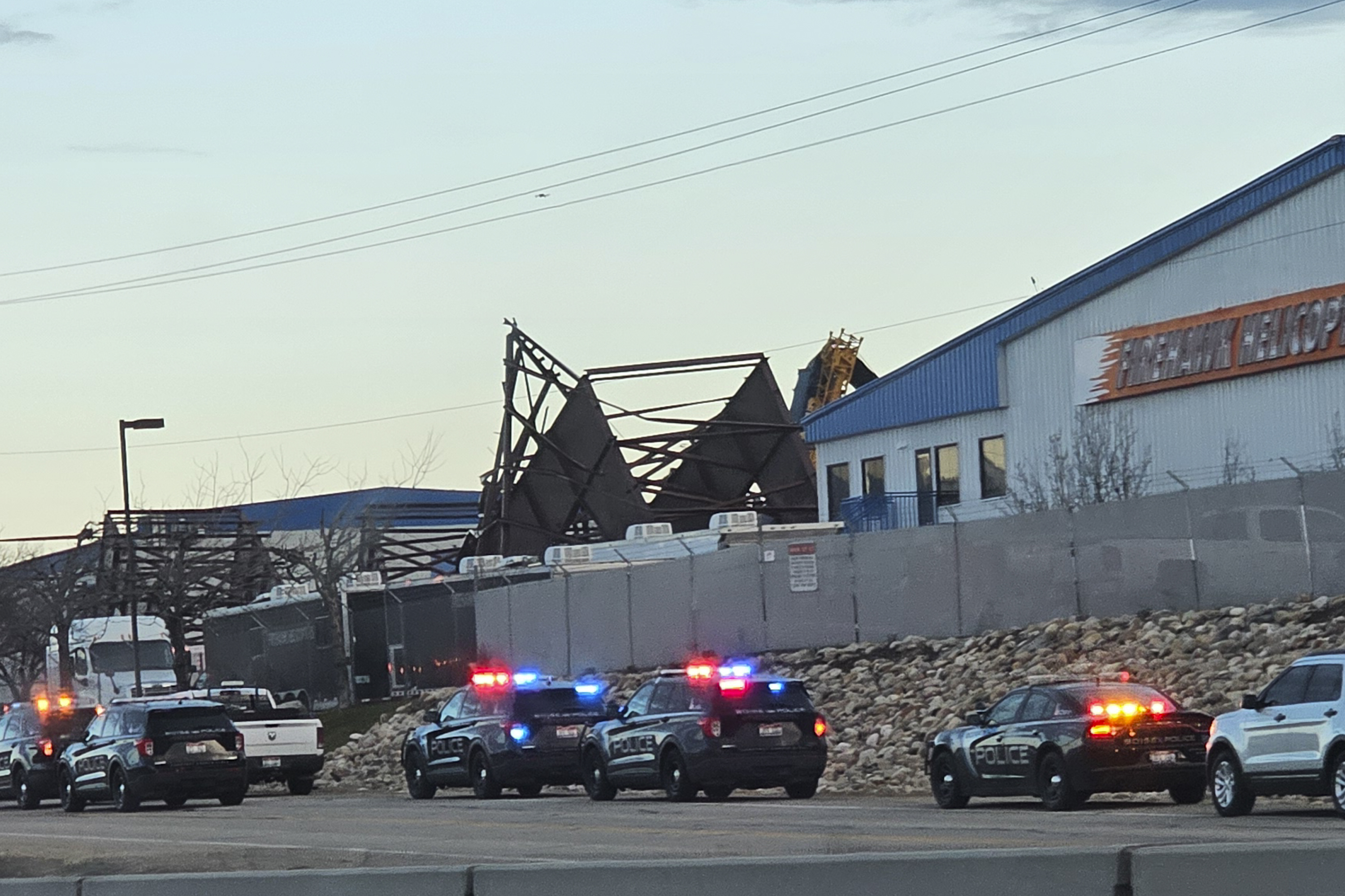 Authorities respond to the scene of a reported building collapse near the Boise Airport on Wednesday, in Boise.
