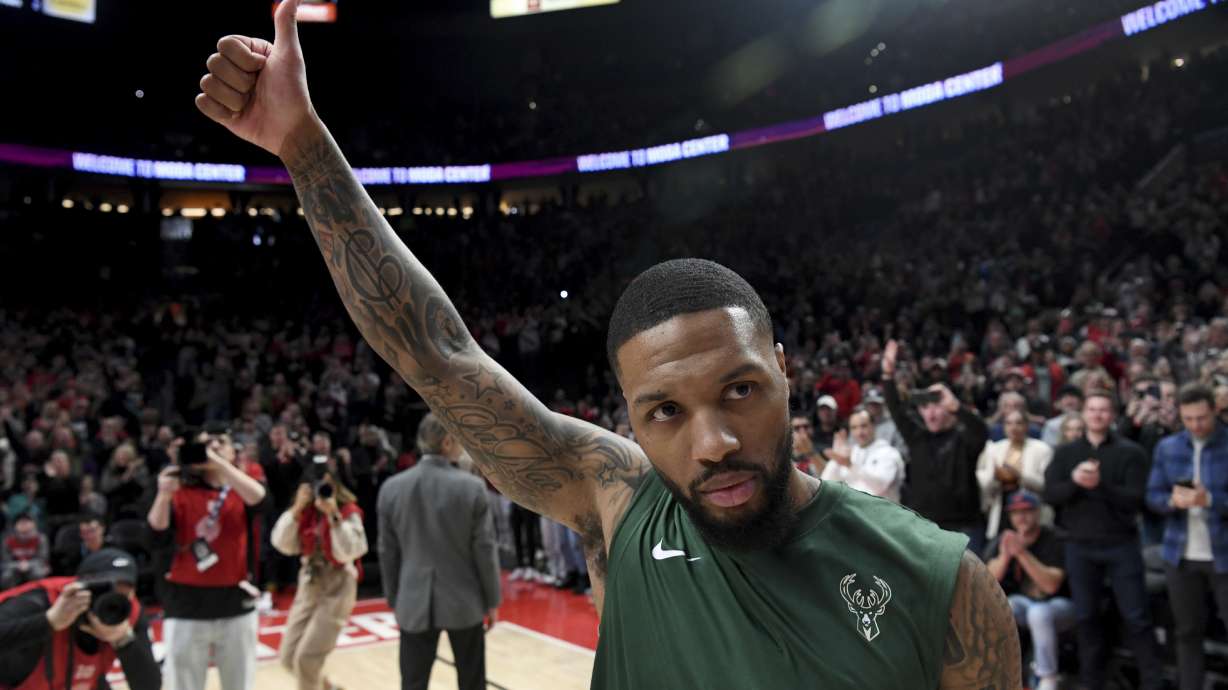 Milwaukee Bucks guard Damian Lillard acknowledges the crowd as he is introduced before an NBA basketball game against the Portland Trail Blazers in Portland, Ore., Wednesday, Jan. 31, 2024.