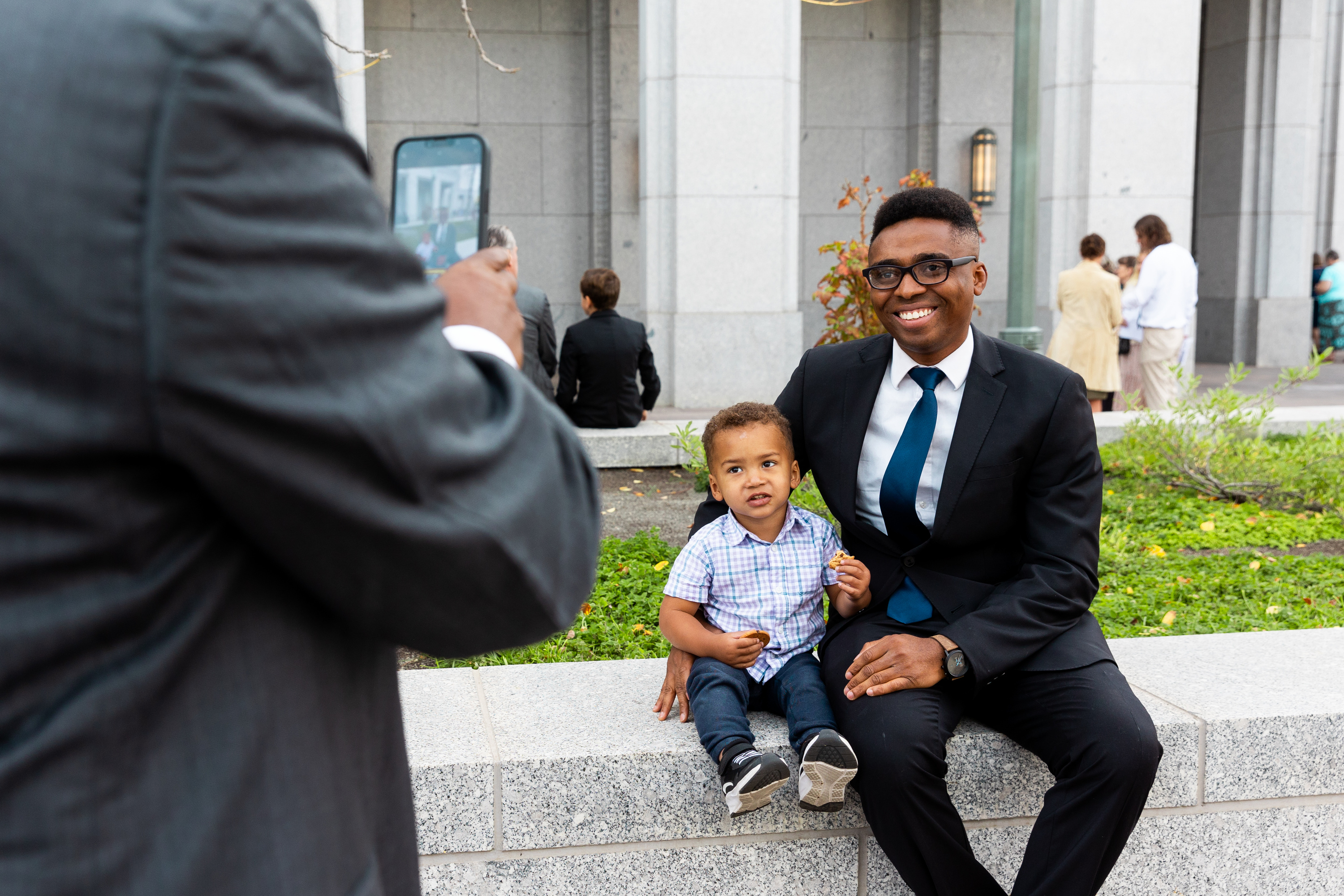 Davis Ebohon poses with his son Ikponmwosa Ebohon before the 193rd Semiannual General Conference of The Church of Jesus Christ of Latter-day Saints in Salt Lake City on Sept. 30, 2023.