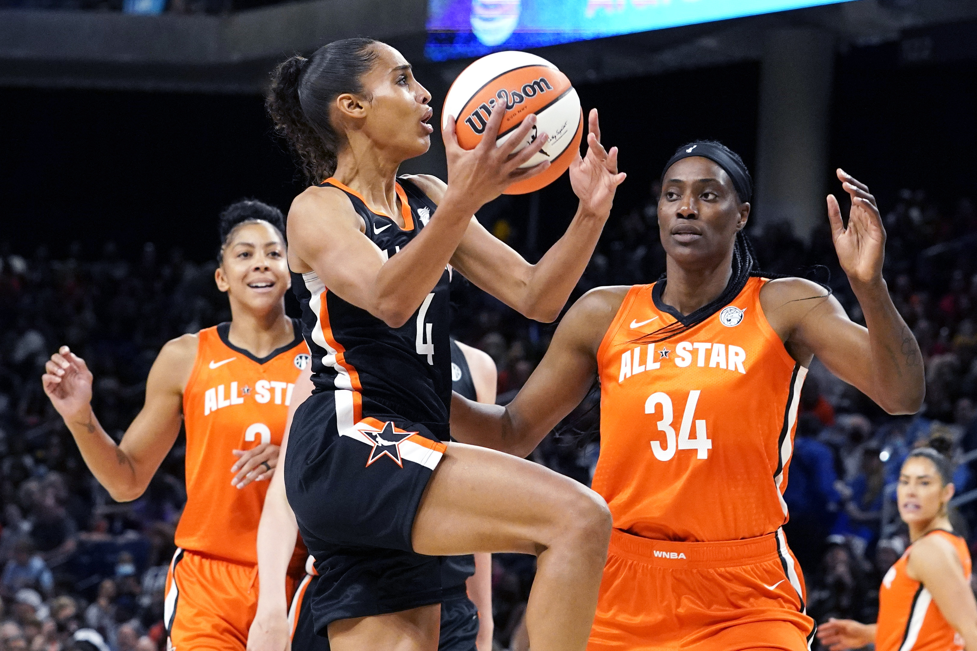 FILE - Team Stewart's Skylar Diggins-Smith, center, drives to the basket against Team Wilson's Candace Parker, left, and Sylvia Fowles during the first half of a WNBA All-Star basketball game in Chicago, Sunday, July 10, 2022. Seattle signed Skylar Diggins-Smith as WNBA free agency tipped off Thursday, Feb. 1, 2024. 