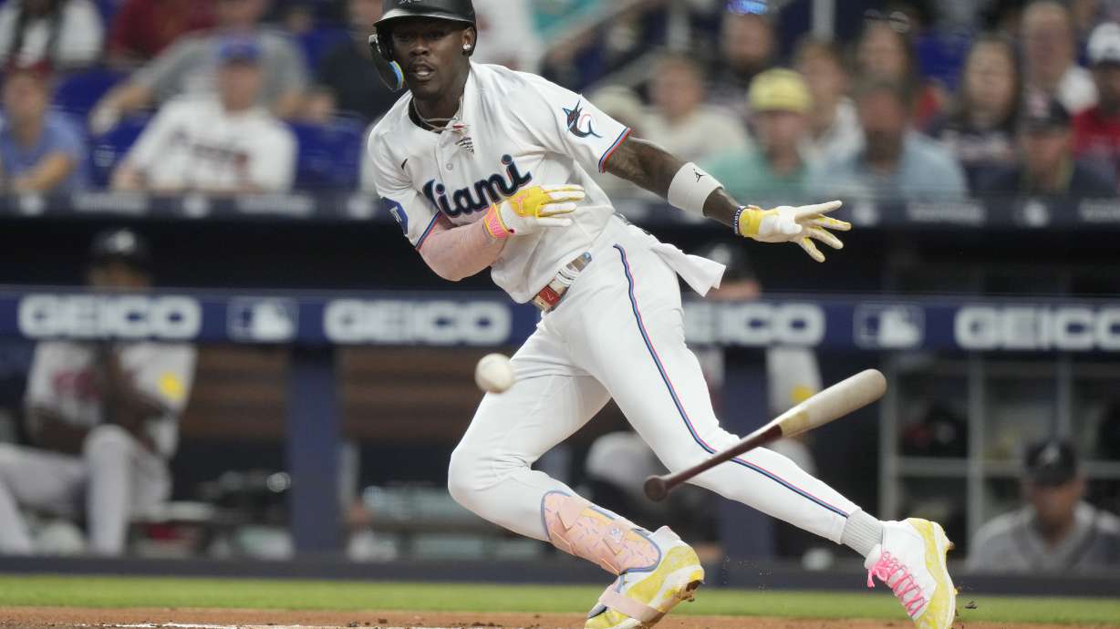 FILE -Miami Marlins' Jazz Chisholm Jr. attempts a bunt during the first inning of a baseball game against the Atlanta Braves, Sunday, Sept. 17, 2023, in Miami. Jazz Chisholm Jr. and the Miami Marlins went to salary arbitration Wednesday, Jan. 31, 2024 when the outfielder asked a three-person panel to be paid $2.9 million this year and the team asked he be given $2,625,000.