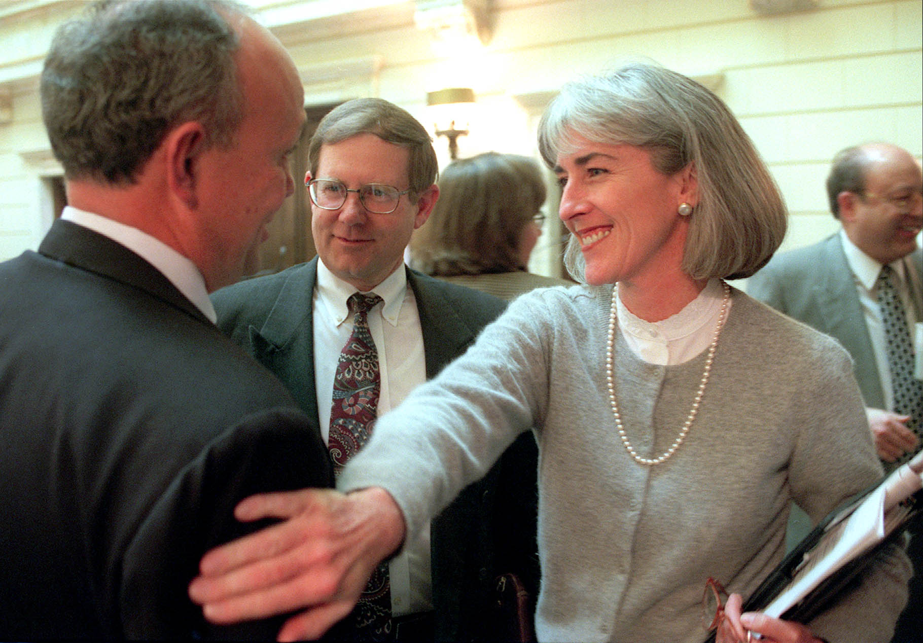 Attorney General Jan Graham gives Senate President Lane Beattie a friendly pat on the shoulder Feb. 25, 1999. Graham has died, former Utah Minority Leader Scott Howell said in a statement Thursday.