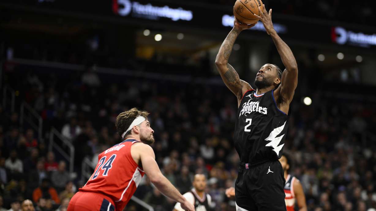 Los Angeles Clippers forward Kawhi Leonard (2) goes to the basket against Washington Wizards forward Corey Kispert (24) during the first half of an NBA basketball game, Wednesday, Jan. 31, 2024, in Washington.