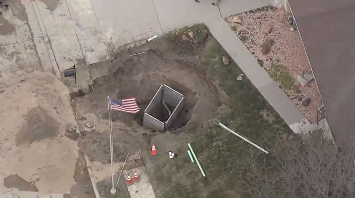 Repairs are underway in Sandy after a water main break created a large sinkhole in a couple's front yard.