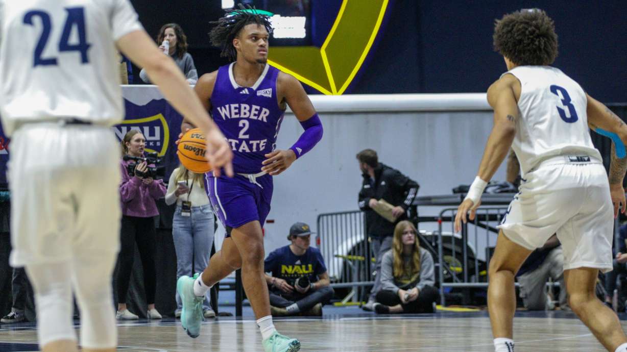 Dillon Jones dribbles against Northern Arizona during Weber State's win over the Lumberjacks, Thursday, Feb. 1, 2024 in Flagstaff, Ariz.