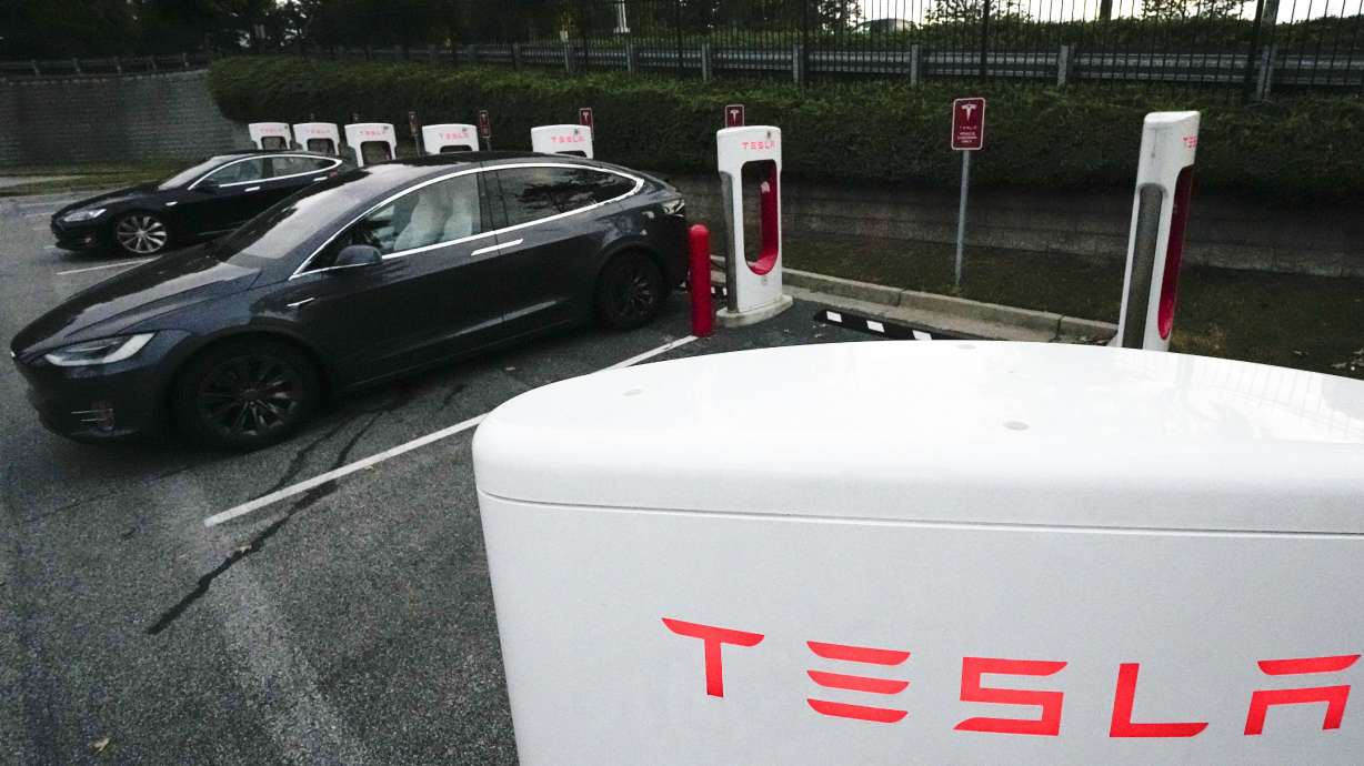 Tesla vehicles charge Sept. 27, 2023, in Woodstock, Ga.