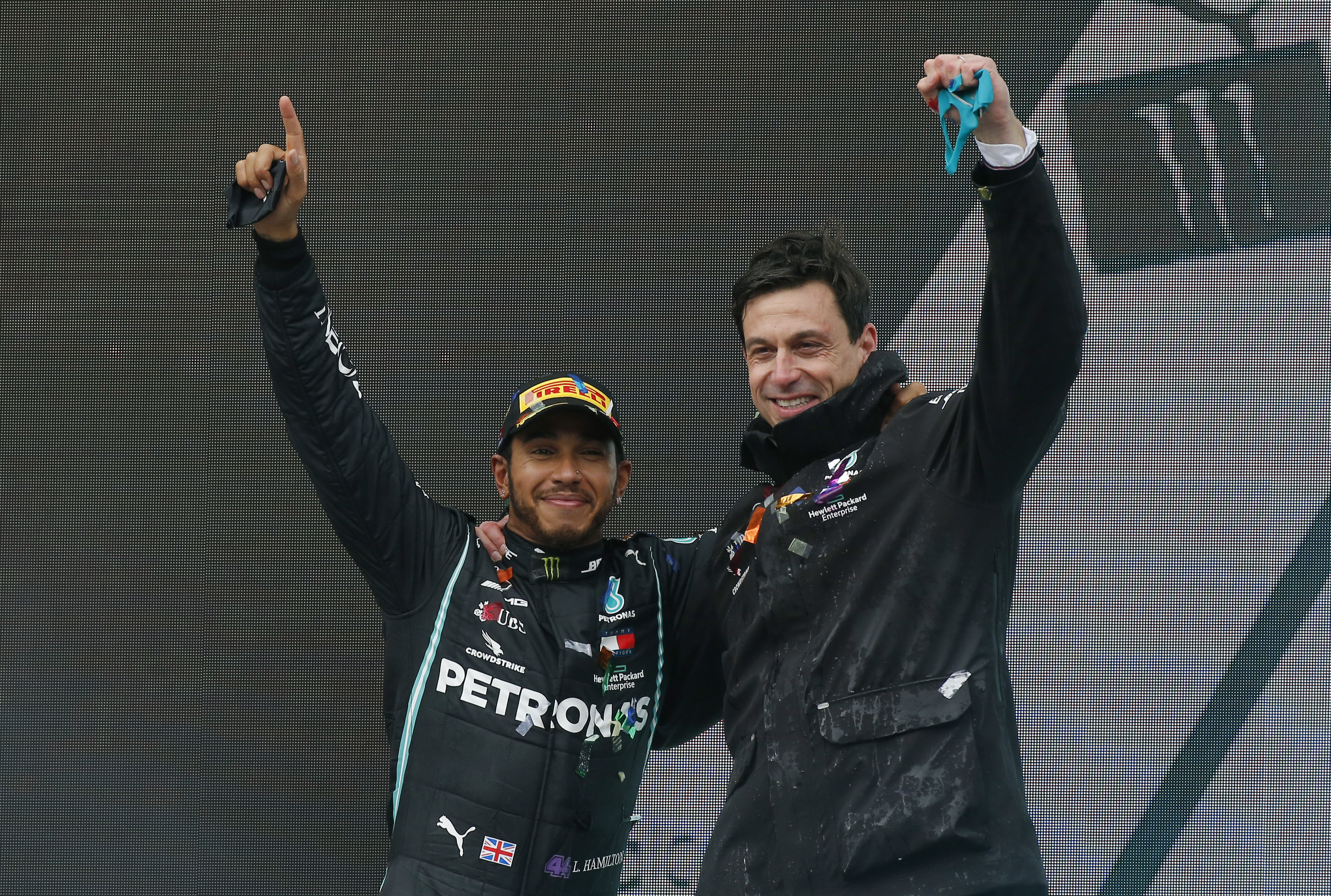 FILE - Mercedes driver Lewis Hamilton of Britain and Mercedes team principal Toto Wolff, right, celebrate after Hamilton won the race and his seventh world championship at the Formula One Turkish Grand Prix at the Istanbul Park circuit racetrack in Istanbul, Sunday, Nov. 15, 2020. Lewis Hamilton’s decision to leave Mercedes for Ferrari shocked the Formula One world with even Mercedes team principal Toto Wolff calling it a “surprise.” Wolff said he had heard rumors that Hamilton might leave but didn’t know for sure until the F1 great confirmed it over breakfast on Wednesday, Jan. 31, 2024 at Wolff’s home in Oxford, England.