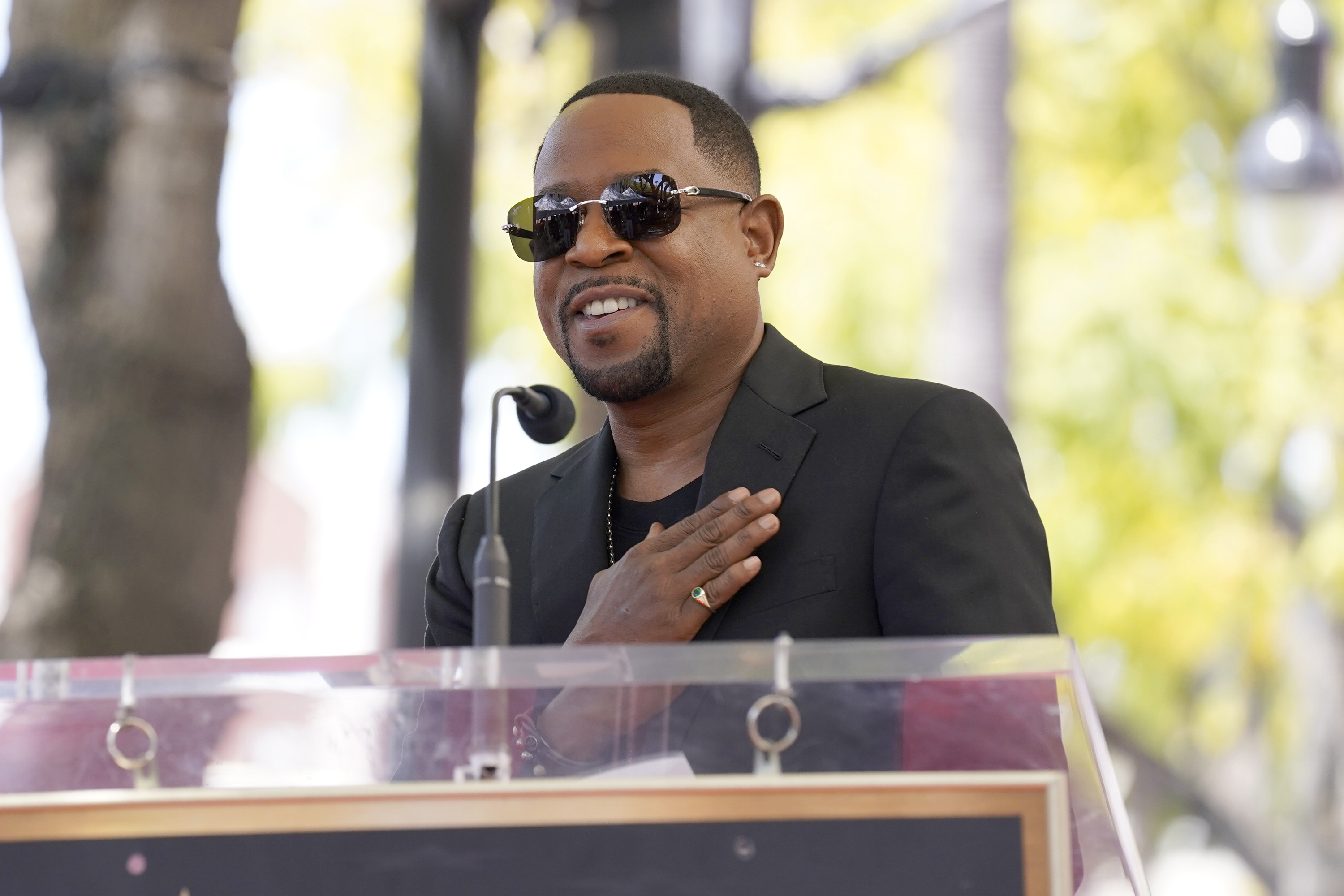 FILE - Martin Lawrence speaks during a star ceremony on the Hollywood Walk of Fame in his honor in Los Angeles on April 20, 2023. Lawrence will star starred alongside Hall of Fame football player Shannon Sharpe in a Super Bowl commercial. 