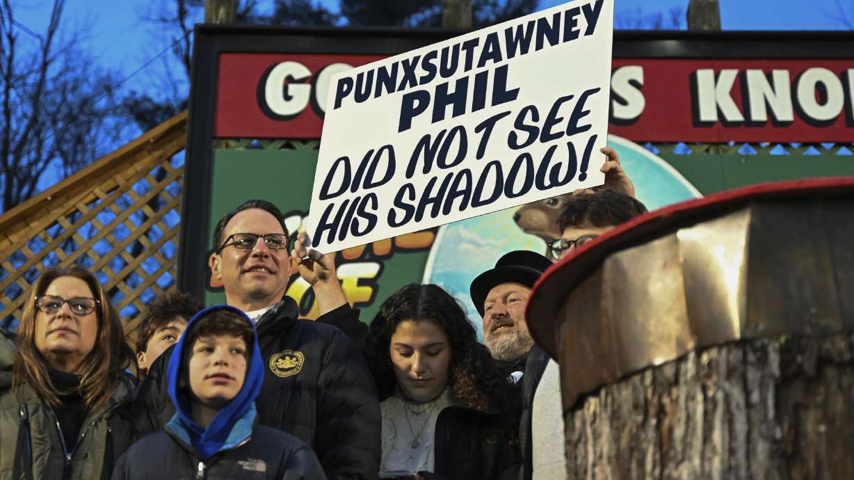 Pennsylvania Gov. Josh Shapiro watches Punxsutawney Phil, the weather prognosticating groundhog, in Punxsutawney, Pennsylvania on Friday. Phil's handlers said that the groundhog has forecast an early spring.