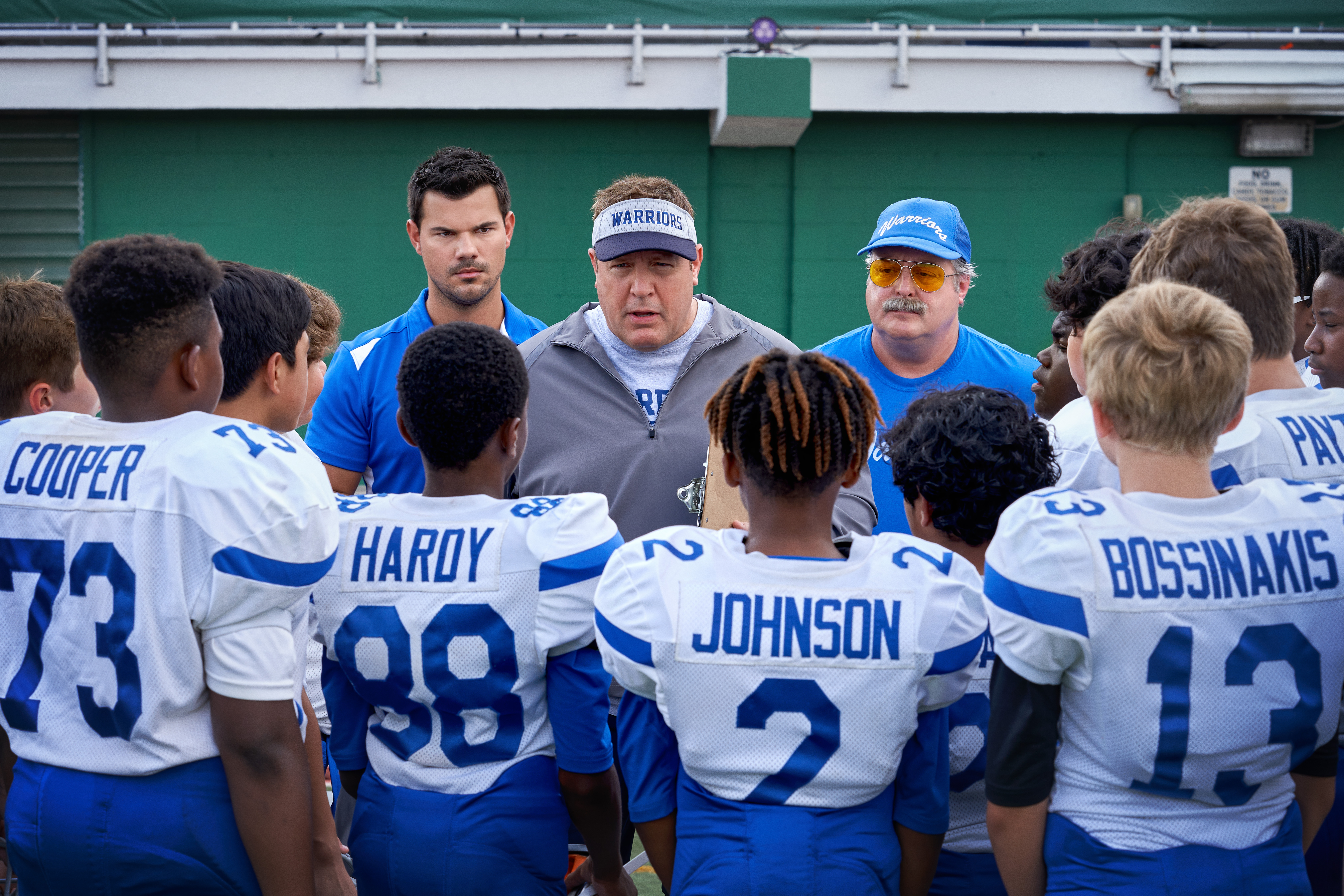 Home Team (L-R) Jacob Perez as Marcos, Taylor Lautner as Troy Lambert, Christopher Farrar as Jason, Kevin James as Sean Payton, Gary Valentine as Mitch Bizone, Manny Magnus as Harlan, Tait Blum as Connor.