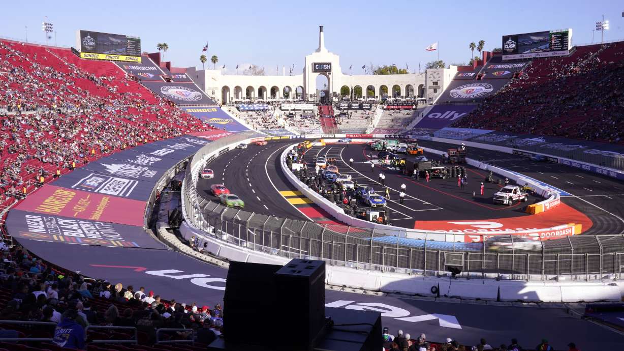 FILE - Cars race during the qualifying portion of the Busch Light Clash NASCAR exhibition auto race at Los Angeles Memorial Coliseum Sunday, Feb. 5, 2023, in Los Angeles. NASCAR returns to Los Angeles Memorial Coliseum for a third consecutive year for the exhibition Clash and the immediate future of racing in Southern California is at stake.