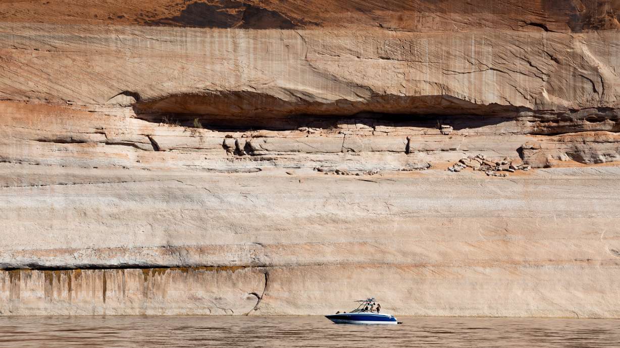 A boat is seen in Lake Powell near Bullfrog on Oct. 6, 2022. The reservoir, a part of Glen Canyon National Recreation Area, experienced record visitation in 2023 as its waters rose, National Park Service data shows.