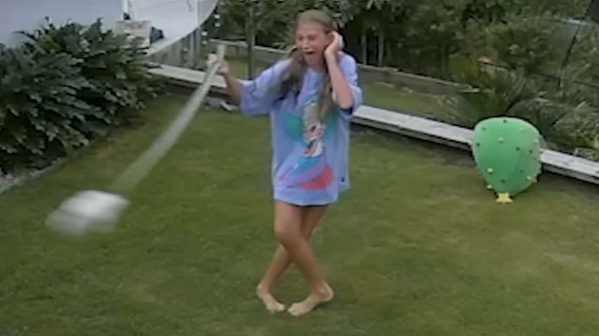 A girl in Australia took danger into her own hands when she rushed a large snake to save her guinea pig.