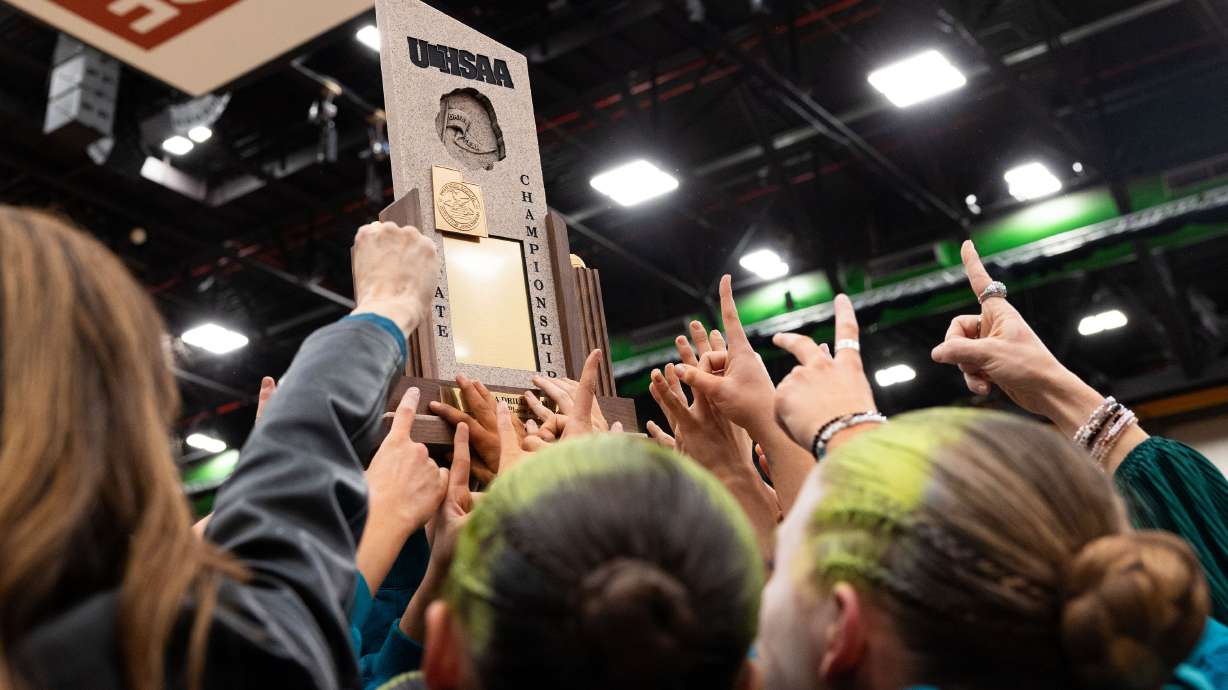 Members of Farmington High School’s drill team reacts to their win at the 6A state drill team championship at the UCCU Center in Orem on Friday, Feb. 2, 2024. Farmington took first place in every category — military, dance, show and overall.