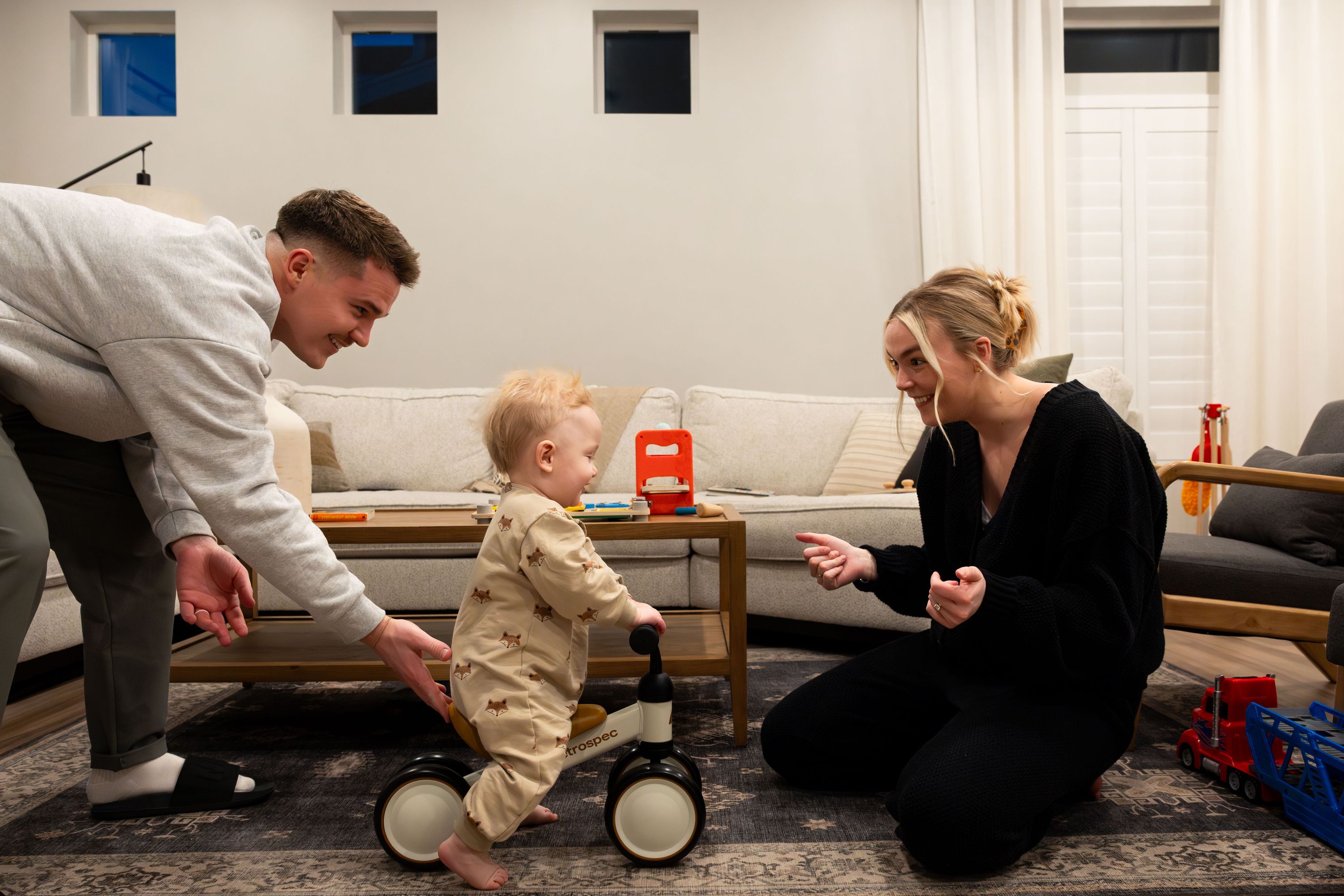 Cole and McCall Porter play with their son Jack, 1, at their home in Saratoga Springs on Jan. 31. The Porters purchased their first home in 2022. Although 2023 was not an ideal year for potential homebuyers, there is hope for 2024.