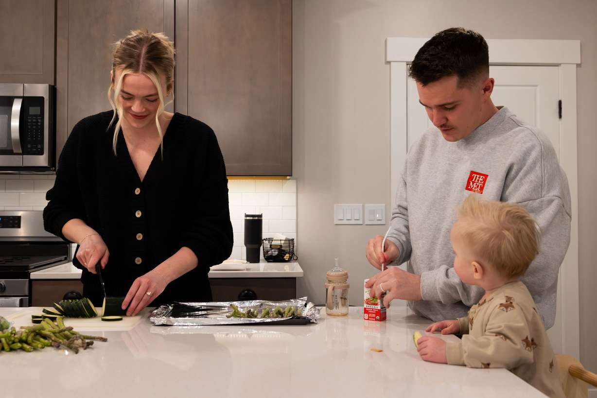 McCall and Cole Porter make dinner and feed their son Jack, 1, at their home in Saratoga Springs on Jan. 31.