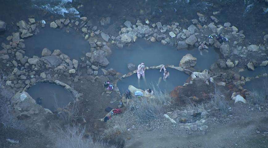 Bathers relax in the Ogden hot pots this week.