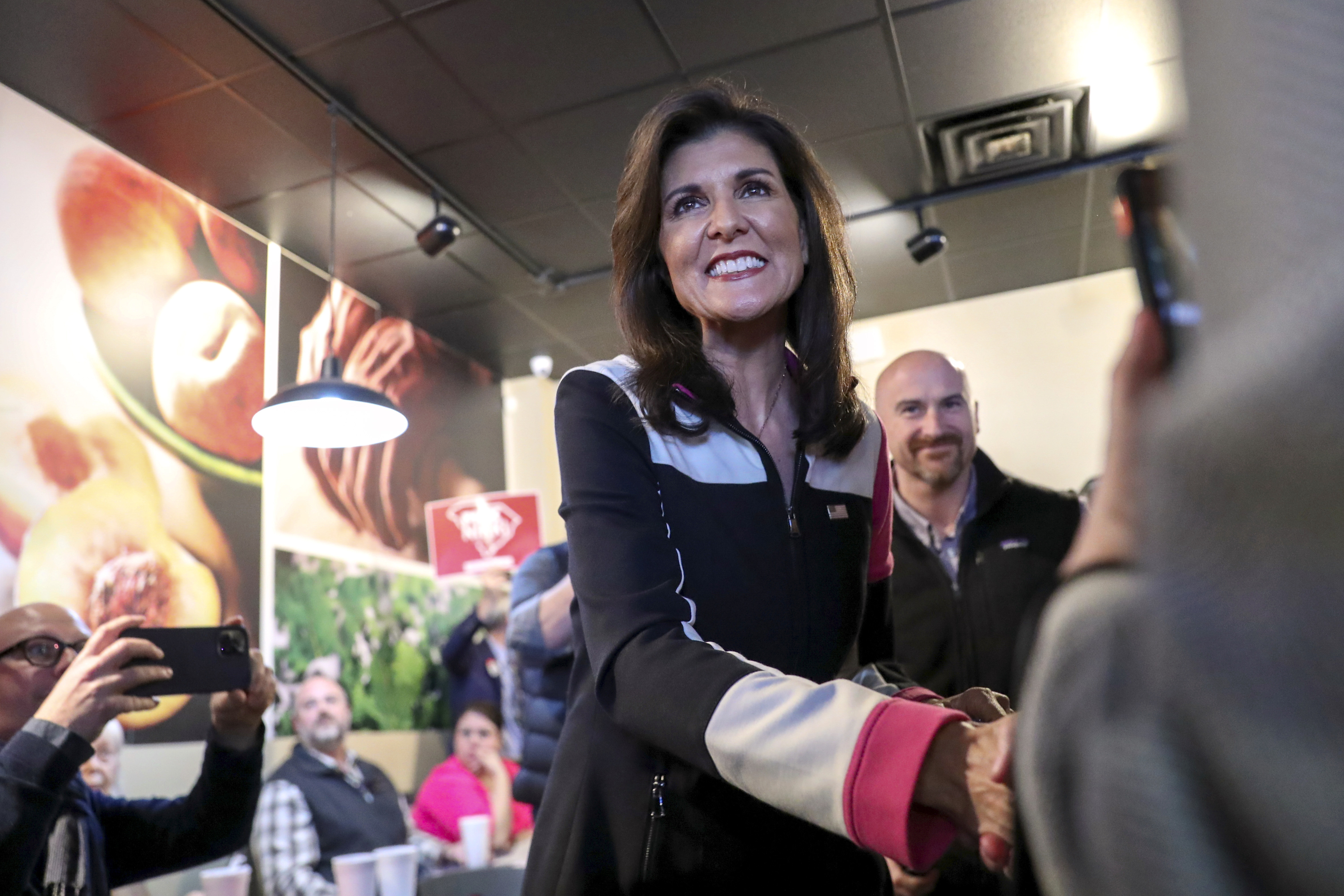 Republican presidential candidate former UN Ambassador Nikki Haley shakes hands with a supporter before a campaign event on Feb. 1 in Columbia, S.C.