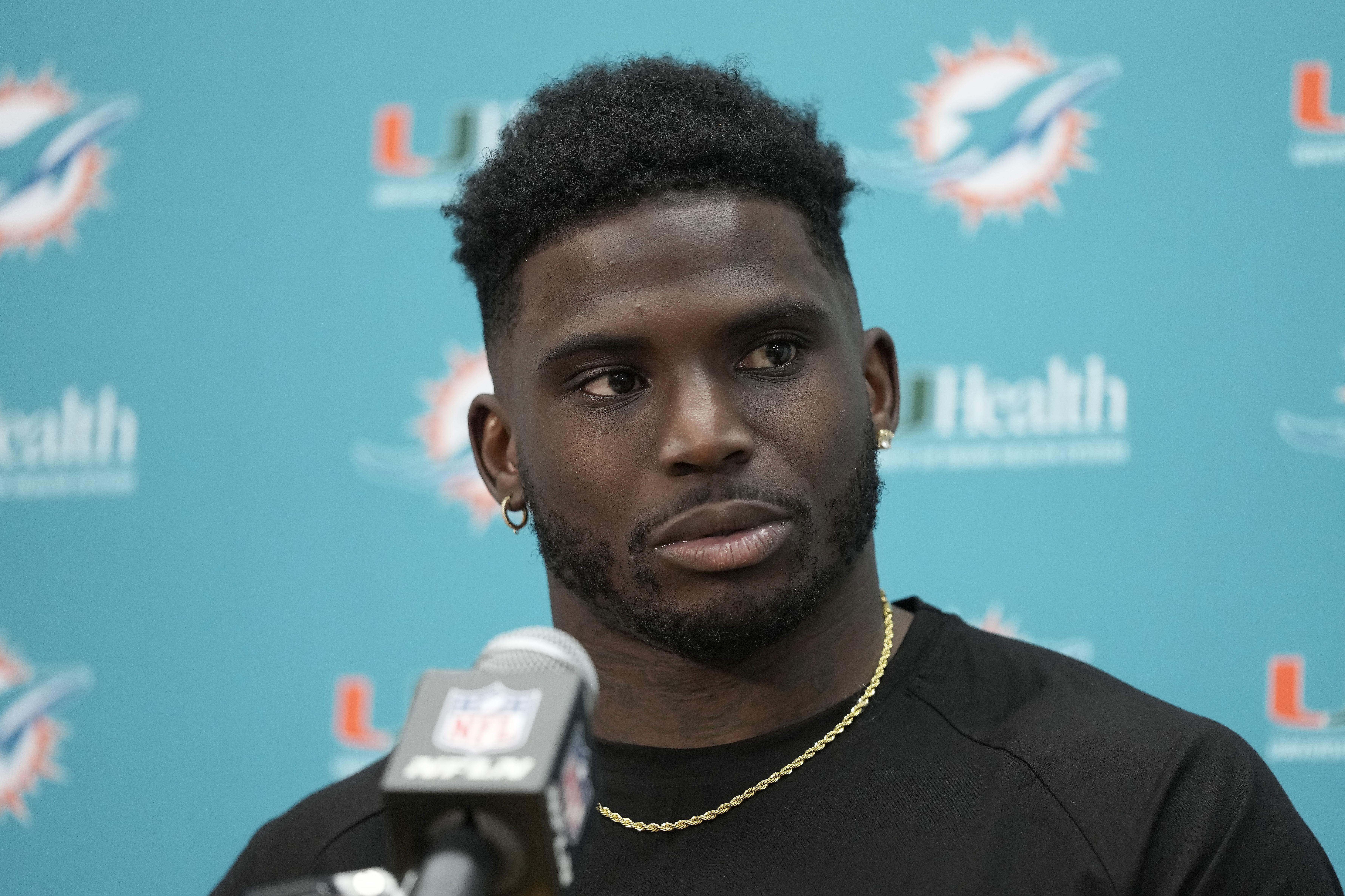 FILE - Miami Dolphins wide receiver Tyreek Hill speaks to reporters after an NFL football game against the Washington Commanders Sunday, Dec. 3, 2023, in Landover, Md. Tyreek Hill is a finalist for The Associated Press 2023 Offensive Player of the Year.