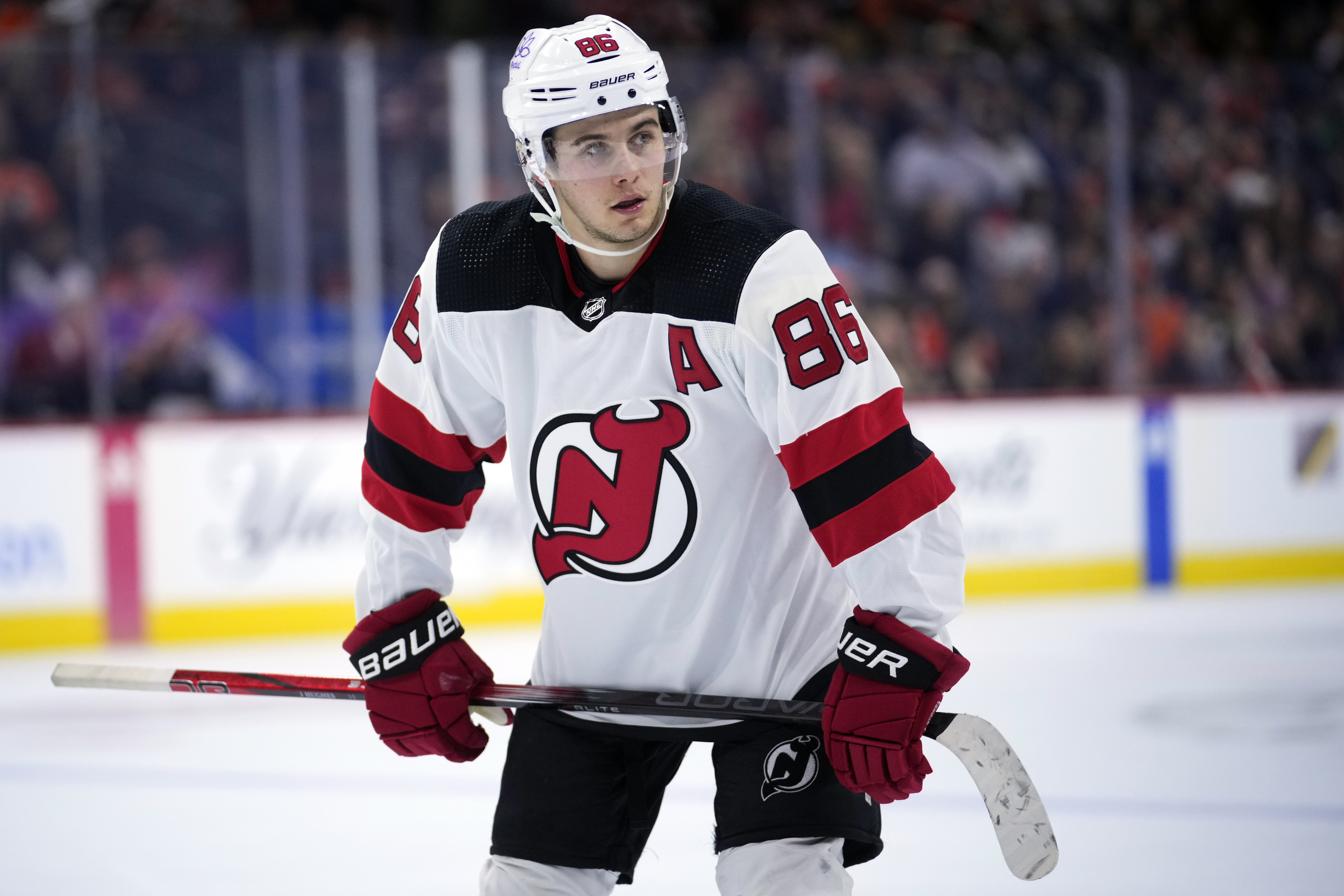 FILE - New Jersey Devils' Jack Hughes plays during an NHL hockey game, Thursday, Nov. 30, 2023, in Philadelphia. Hughes will not participate in the skills competition or 3-on-3 tournament at the upcoming NHL All-Star Weekend because of injury. 