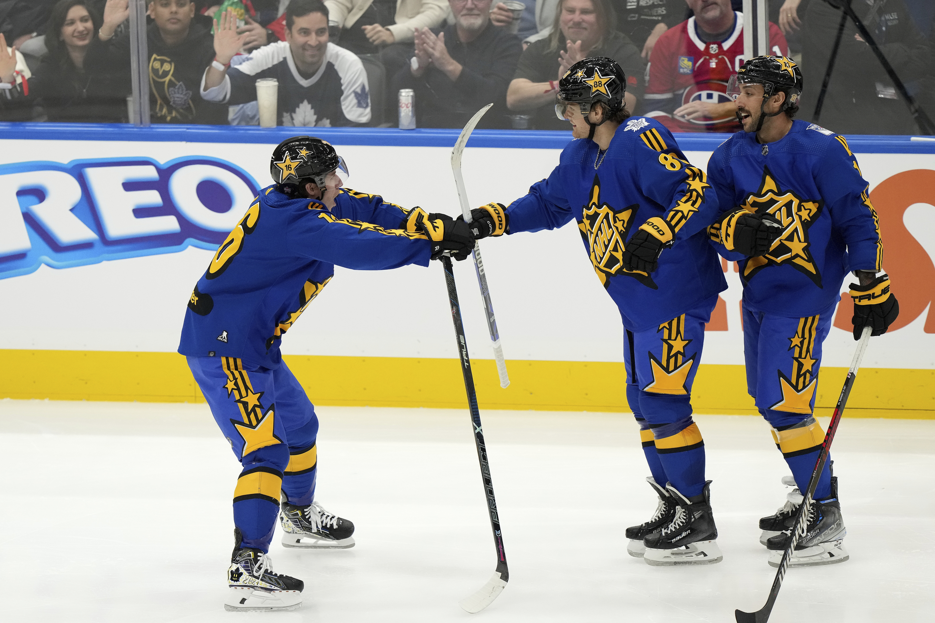 NHL All-Star Team Matthews forward Mitch Marner (16), left, of the Toronto Maple Leafs, celebrates with forward William Nylander (88), of the Toronto Maple Leafs, and forward Vincent Trocheck (16), of the New York Rangers, after his goal against Team McDavid during the NHL All-Star Game 3-on-3 hockey tournament in Toronto, Ontario, Saturday, Feb. 3, 2024.