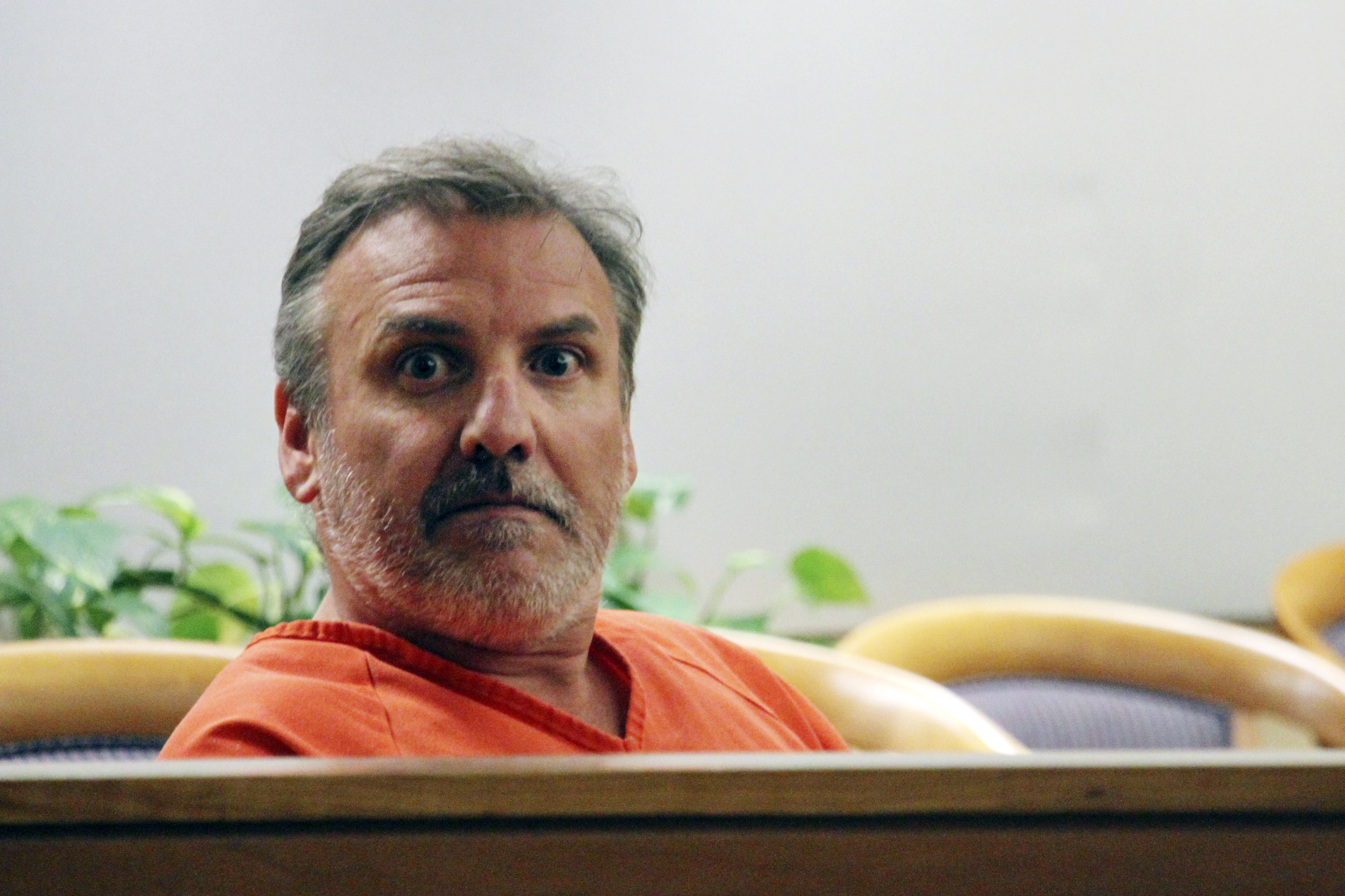 Brian Steven Smith sits in a courtroom while waiting for his arraignment to start in Anchorage, Alaska, Oct. 16, 2019. A double murder trial will begin this week.