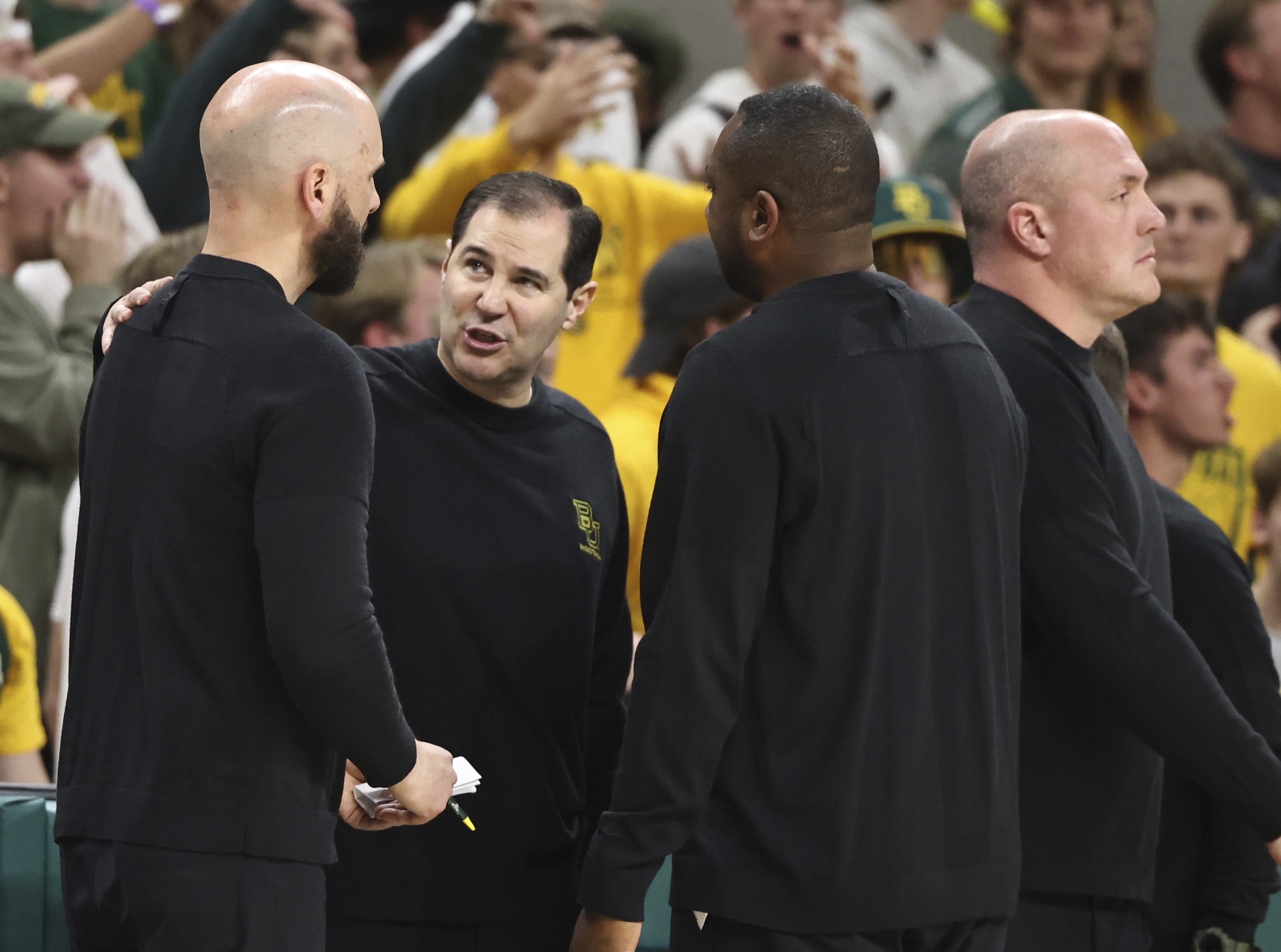 Baylor head coach Scott Drew, center, talks with his coaches after getting a second technical foul in the second half of an NCAA college basketball game against Iowa State, Saturday, Feb. 3, 2024, in Waco, Texas. 