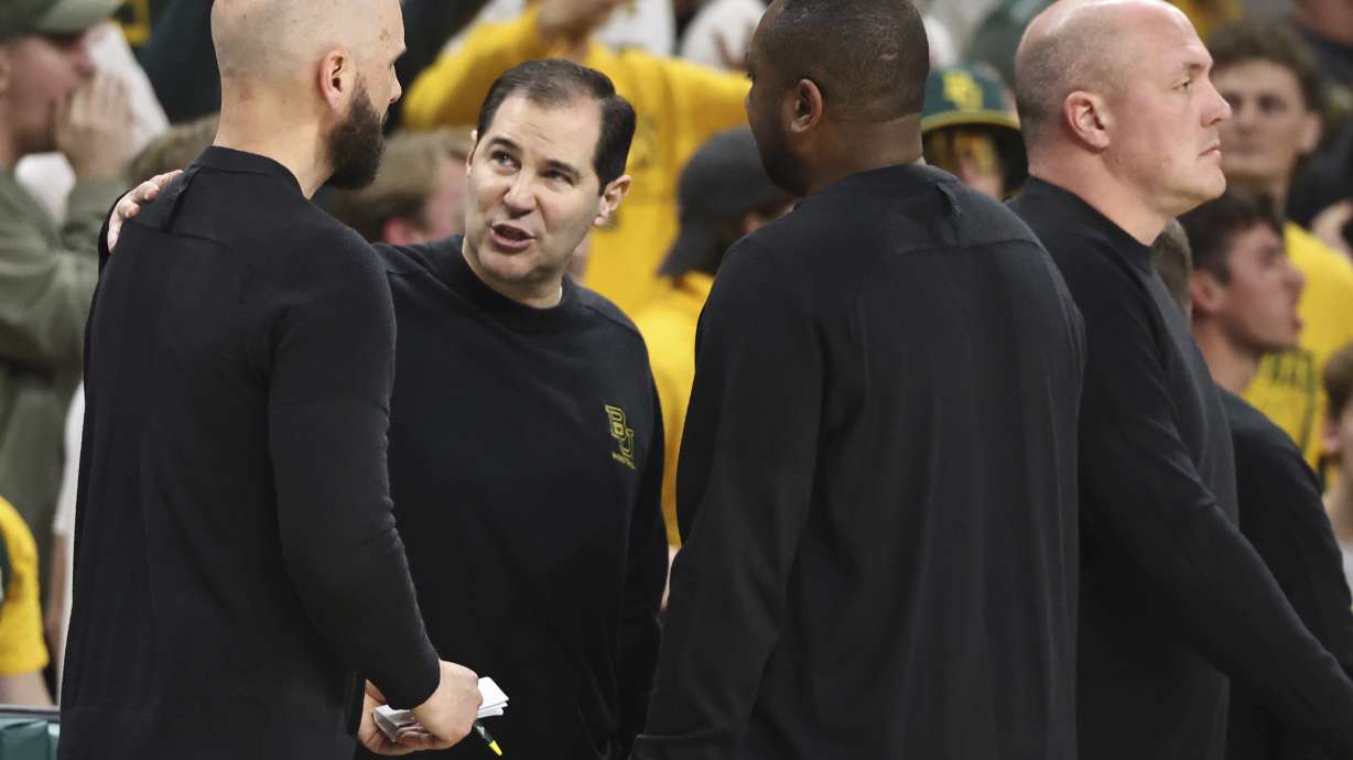 Baylor head coach Scott Drew, center, talks with his coaches after getting a second technical foul in the second half of an NCAA college basketball game against Iowa State, Saturday, Feb. 3, 2024, in Waco, Texas.