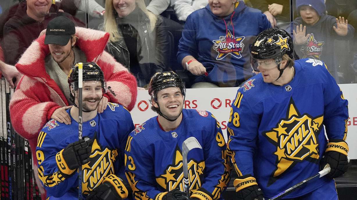 Performer Justin Bieber, second from top left, hypes up NHL All-Star Team Matthews forward Clayton Keller (9), of the Arizona Coyotes, as teammates Alex DeBrincat (93), of the Detroit Red Wings, and William Nylander (88), of the Toronto Maple Leafs, look on during the NHL All-Star Game 3-on-3 hockey tournament in Toronto, Ontario, Saturday, Feb. 3, 2024.