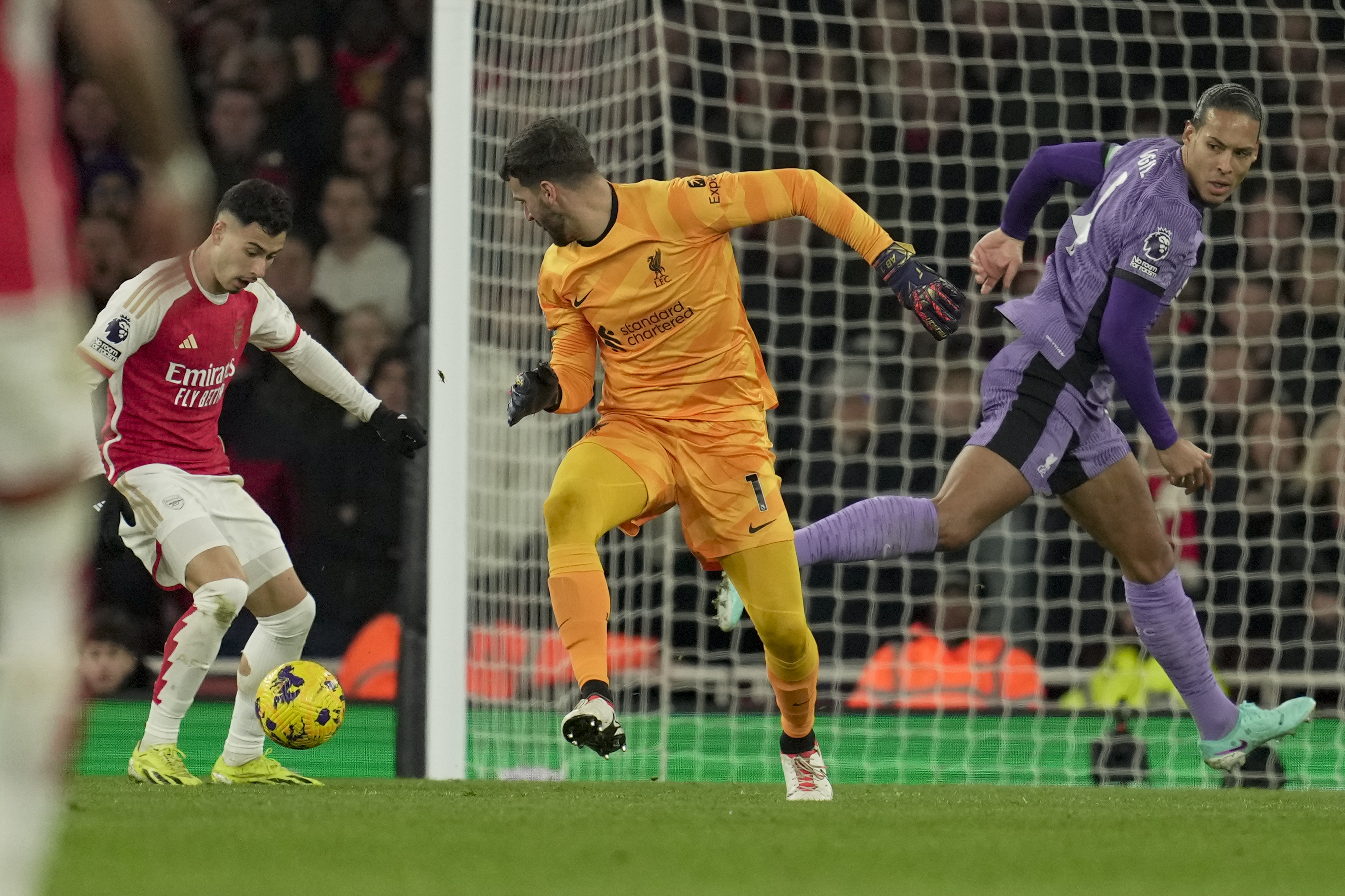 Arsenal's Gabriel Martinelli left, scores his side's second goal during the English Premier League soccer match between Arsenal and Liverpool at Emirates Stadium in London,, Sunday, Feb. 4, 2024. 