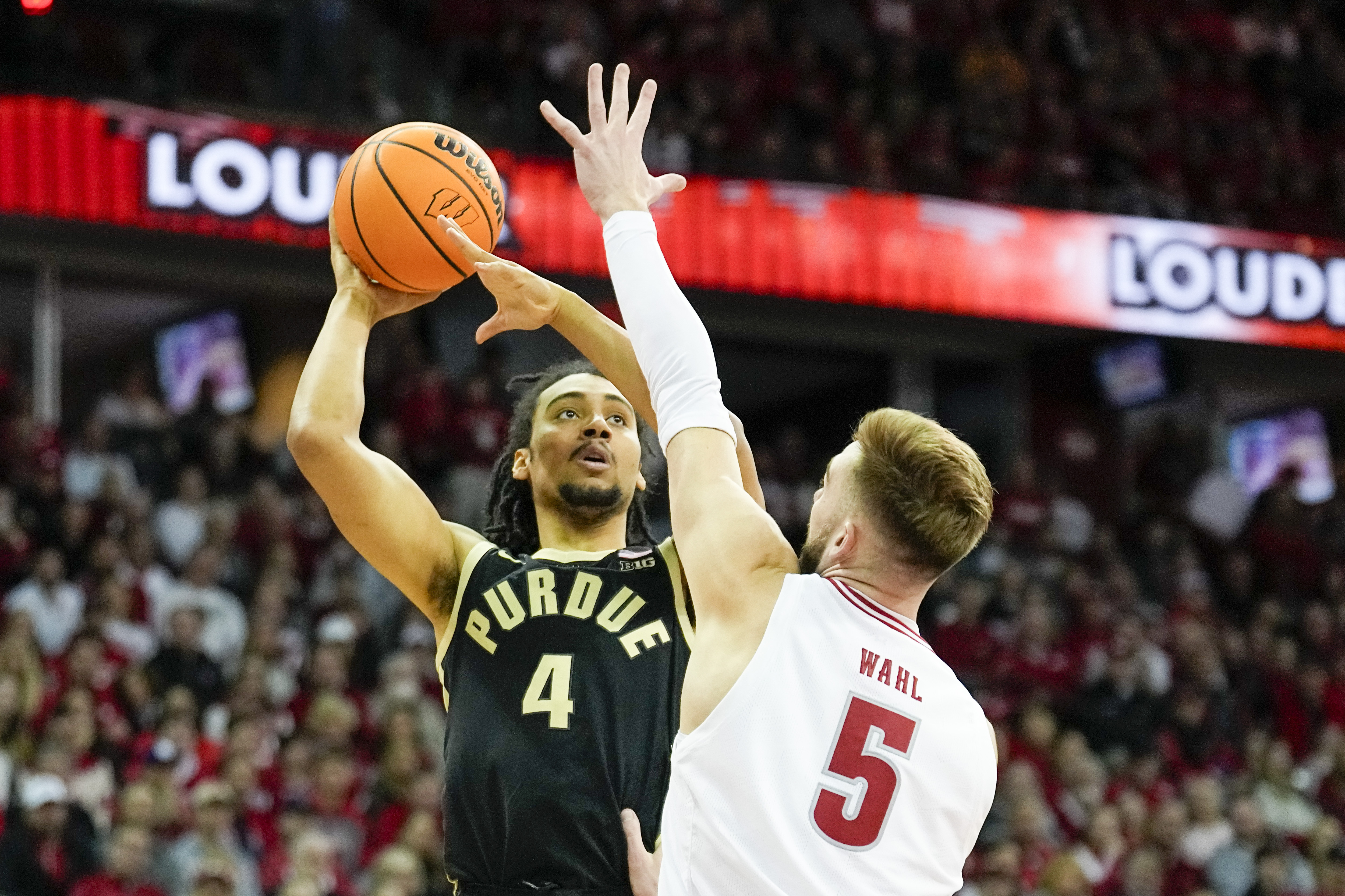 Purdue's Trey Kaufman-Renn (4) shoots against Wisconsin's Tyler Wahl (5) during the first half of an NCAA college basketball game Sunday, Feb. 4, 2024, in Madison, Wis.