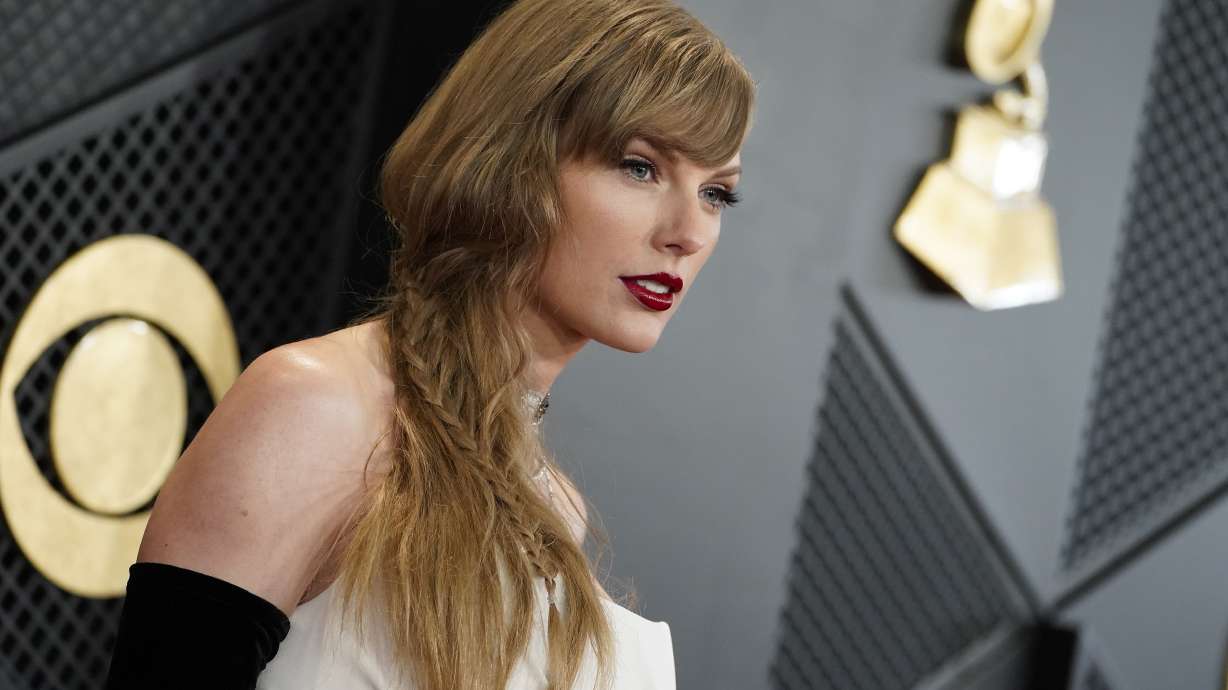 Taylor Swift arrives at the 66th annual Grammy Awards on Sunday in Los Angeles. A Utah bill seeks to prohibit distribution of artificially-generated explicit videos. Swift was the subject of explicit images likely created using artificial intelligence.