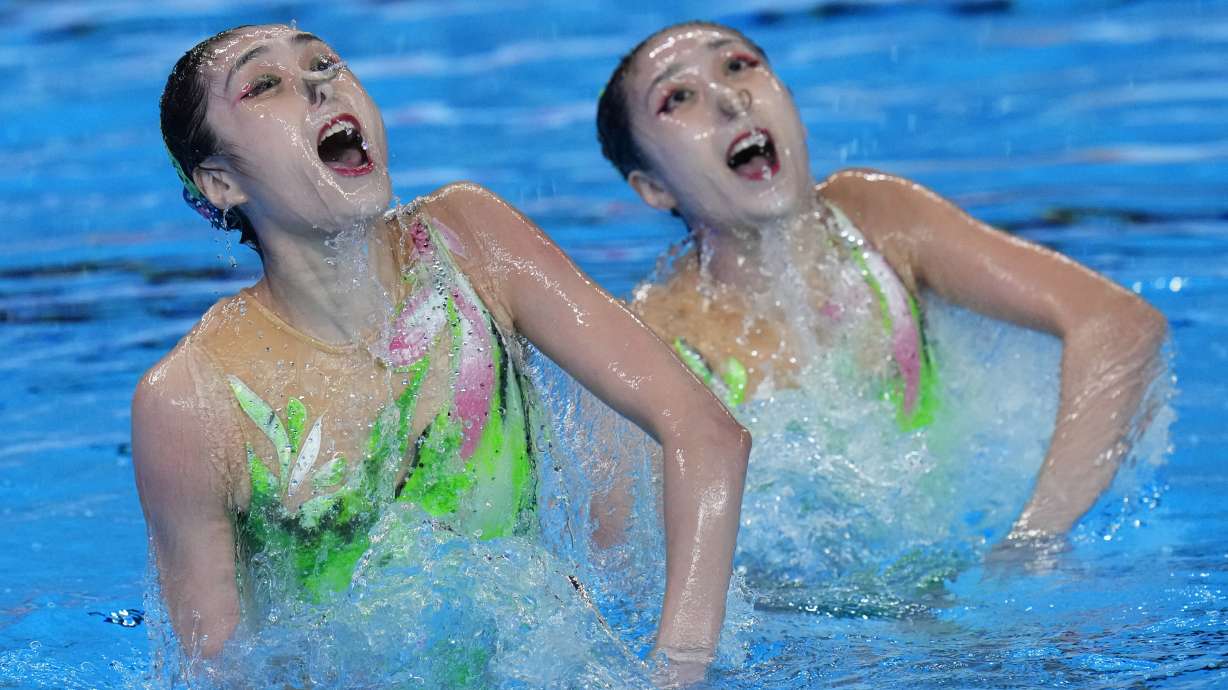 Wang Liuyi and Wang Qianyi of China, compete to win the women's duet technical of artistic swimming at the World Aquatics Championships in Doha, Qatar, Monday, Feb. 5, 2024.