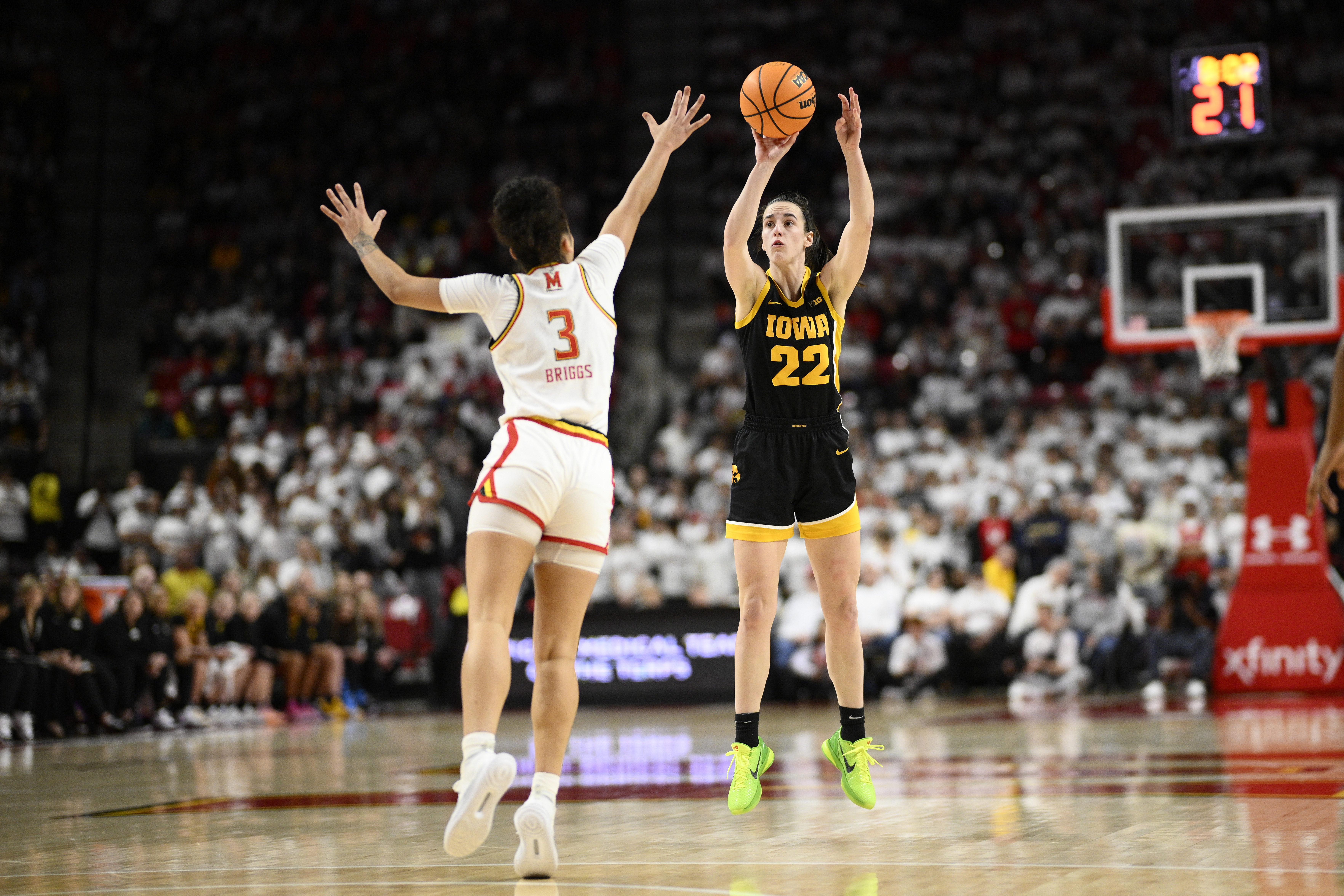 Iowa guard Caitlin Clark (22) shoots against Maryland guard Lavender Briggs (3) during the first half of an NCAA college basketball game, Saturday, Feb. 3, 2024, in College Park, Md. 