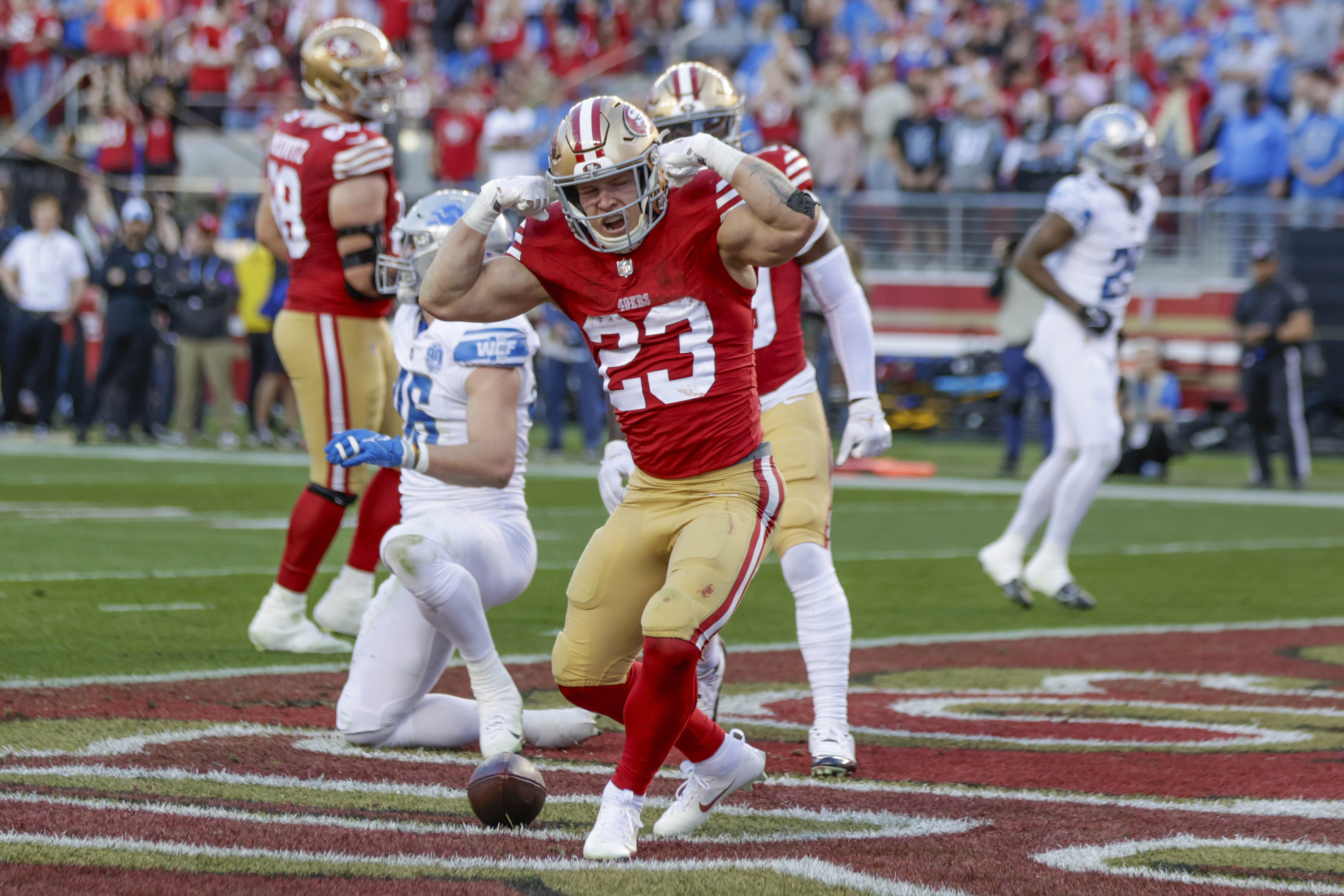 San Francisco 49ers' running back Christian McCaffrey (23) reacts after scoring a touchdown against the Detroit Lions in the second quarter of the NFC Championship NFL football game in Santa Clara, Calif., Sunday, Jan. 28, 2024.