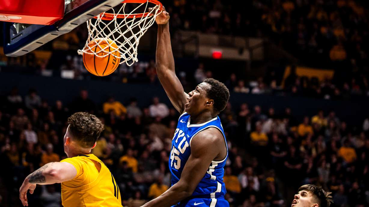 BYU forward Fousseyni Traore throws down a dunk during an 86-73 win over West Virginia, Saturday, Feb. 3, 2024 at the WVU Coliseum in Morgantown, W. Va.