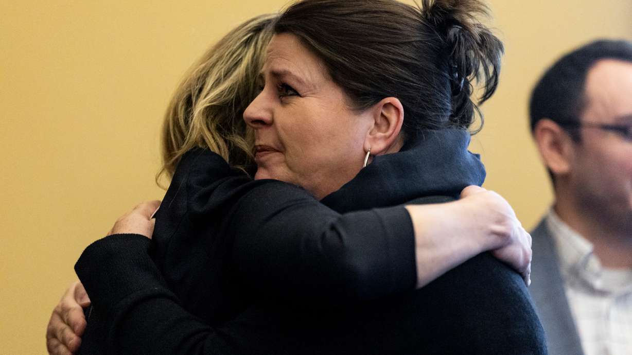 Marlesse Jones hugs Leah Moses at the Utah Domestic Violence Coalition Advocacy Day at the Capitol in Salt Lake City on Monday.