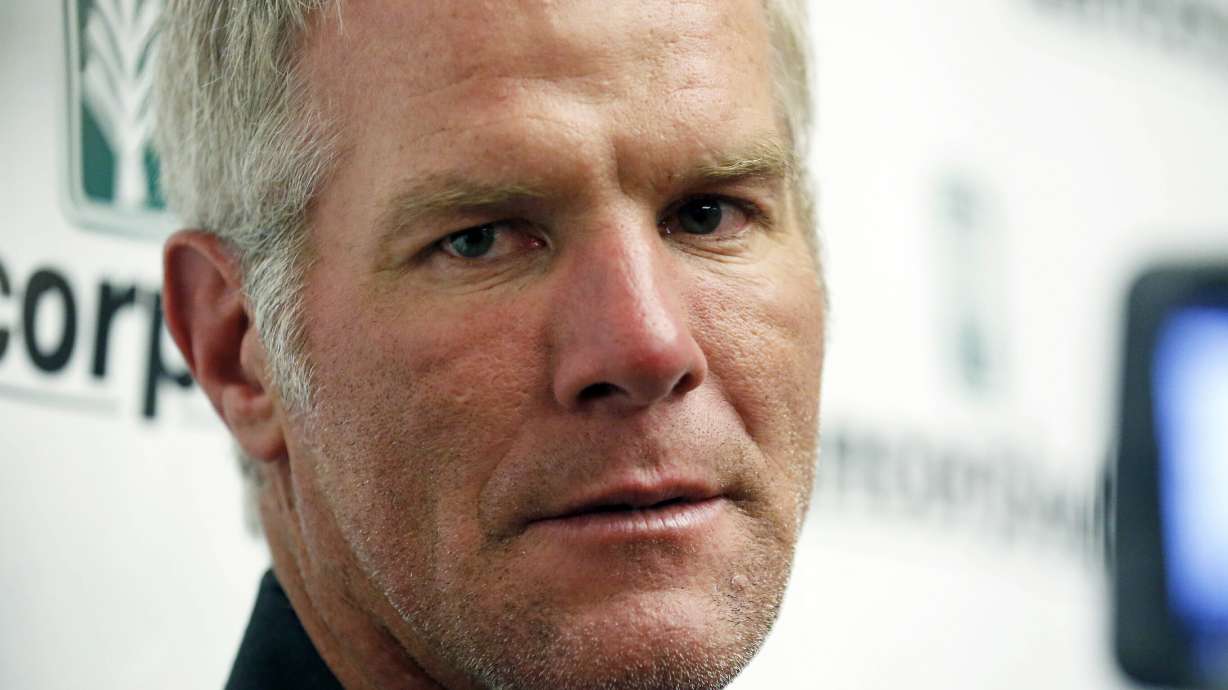 FILE - Former NFL quarterback Brett Favre speaks with reporters prior to his induction to the Mississippi Hall of Fame in Jackson, Miss., Aug. 1, 2015. Mississippi's state auditor filed court papers Monday, Feb. 5, 2024, renewing his call for Favre to repay the state for welfare money that the auditor says was improperly spent on projects backed by the retired NFL quarterback.