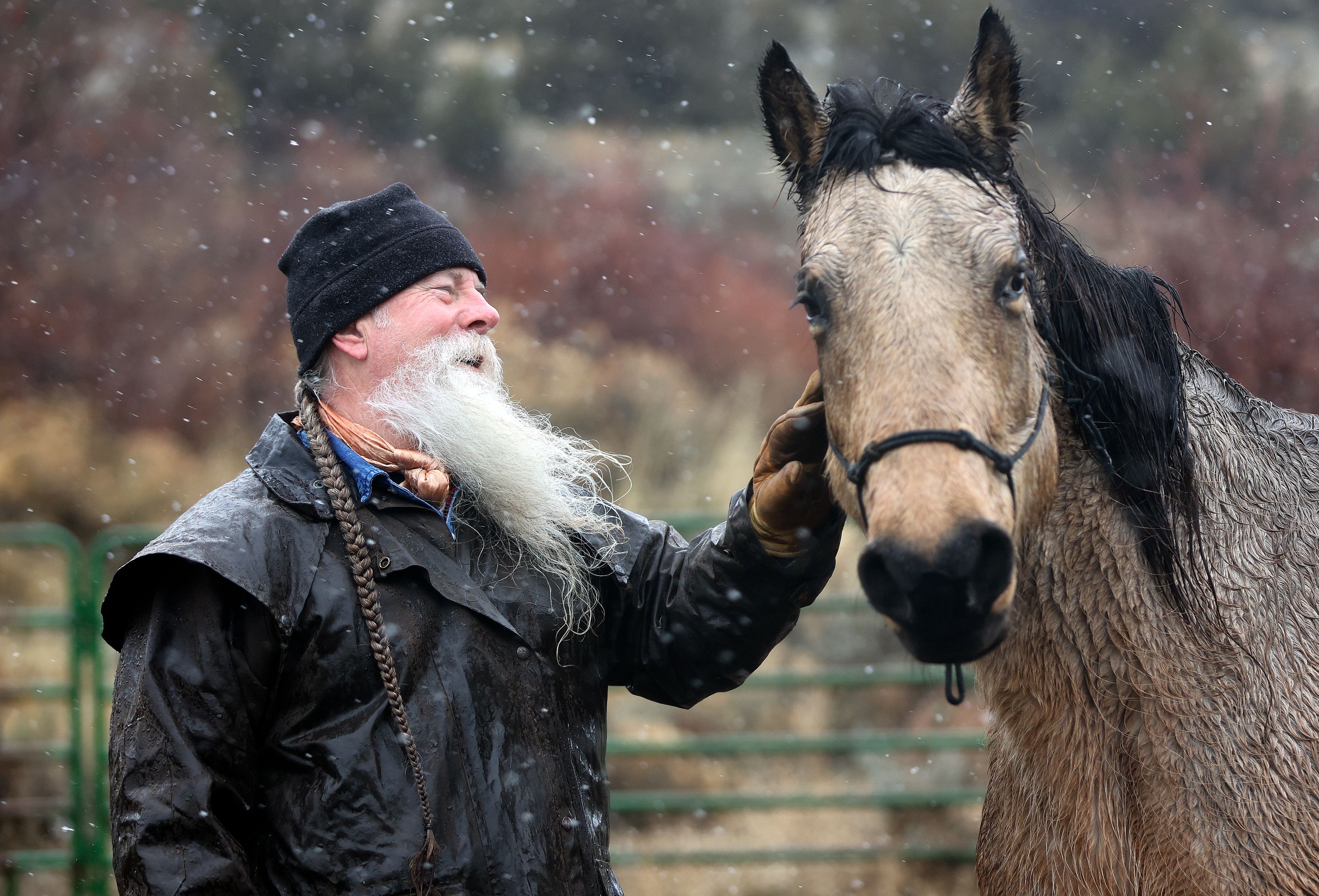 Dave Winters pets his horse Wyoming Rose outside his home in Herriman on Monday.