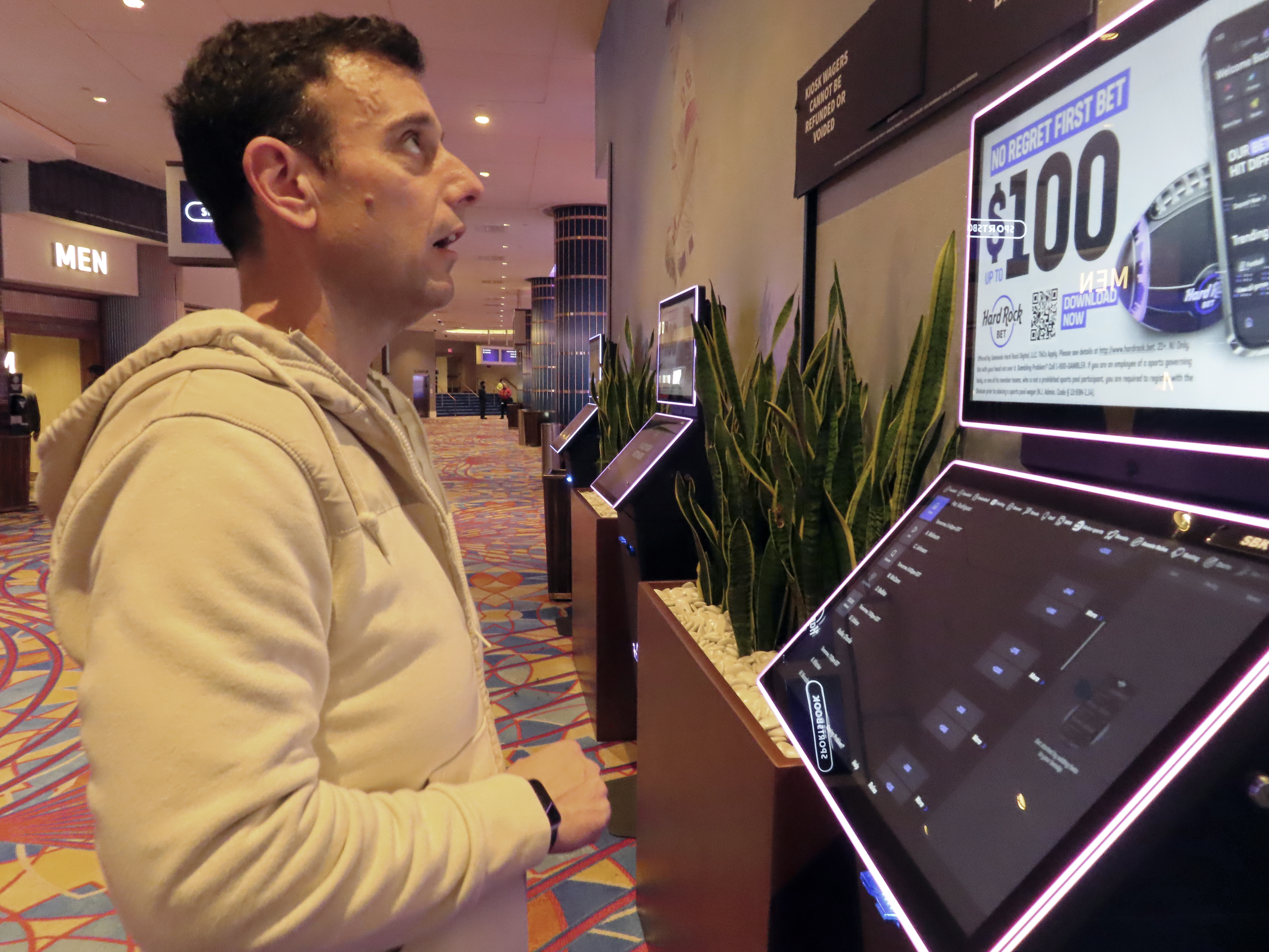 Matt Smircich, of Hamburg, N.J., makes sports bets at the Hard Rock casino in Atlantic City, N.J., Friday, Feb. 2, 2024. On Tuesday, Feb. 6, 2024, the American Gaming Association estimated that a record 68 million Americans would wager a total of $23.1 billion on this year's Super Bowl, legally or otherwise. 